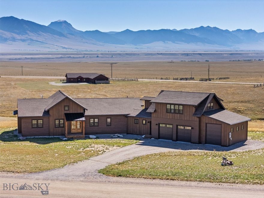 Welcome to this exceptional 3,159± SF custom home on 5.66 acres in the desirable Pronghorn Meadows subdivision. With 8 Mile Creek and a designated wildlife corridor running through the property, this residence offers a true Montana living experience just minutes from Ennis. Designed with comfort and elegance in mind, the main home features 3 bedrooms, 3.5 bathrooms, plus an office, and an open floor plan with fir circle sawn tongue and groove floors, a Montana moss rock propane fireplace with thermostat and blower, and a vaulted living area with reclaimed barnwood circle sawn ceilings and floor-to-ceiling windows framing breathtaking Madison Range views. The chef’s kitchen is a showstopper, boasting a Forno 8-burner gas range with 48” hood, a 48” Forno refrigerator/freezer, Bosch dishwasher, hickory cabinets, granite countertops, tile backsplash, and a large walk-in pantry with barn door. Off the dining room, a 10’ sliding glass door opens to the outdoors. The luxurious master suite offers French door entry, private outdoor access, and a spa-like ensuite with a freestanding soaking tub, oversized custom tile shower, double vanity, and toilet room. Guest spaces include one ensuite with walk-in closet and custom tile shower, plus a second full bath with travertine floors, custom tub/shower, and double vanity. Every closet features a custom organizer system. A 576± SF apartment above the garage provides flexible living space with a kitchen, living room, bedroom, bath, and expansive views. It can also have its own private entrance, if desired, making it ideal for guests, extended family, or long term rental income. Additional highlights include: dedicated office/flex space; mudroom with exterior access, sink, and storage; tile-finished laundry room with sink; two-car garage plus an oversized bay with 10’ door for RVs or recreational vehicles; two water heaters, central air and forced propane heat. Estimated completion is October 31, 2025 and the seller's are offering a $20,000 credit for landscaping. Pronghorn Meadows residents enjoy a community center, equestrian facility, fenced RV storage, trails, and open space while being just minutes from world-class fishing on the Madison River, hunting, hiking, and all the recreational opportunities of Southwest Montana. Conveniently located near Ennis, Yellowstone National Park, Big Sky, and Bozeman.