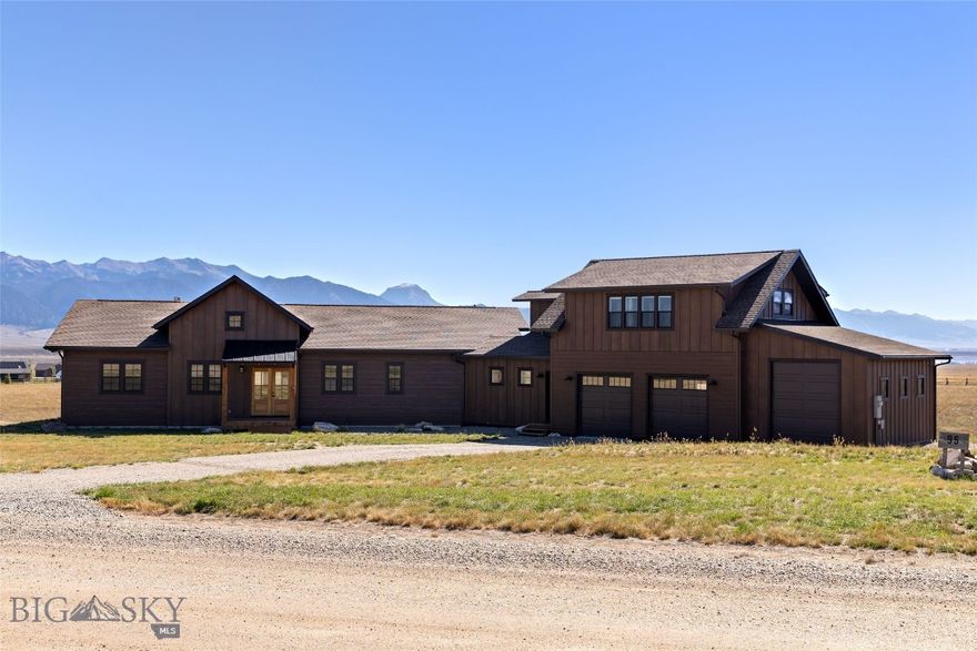 Welcome to this exceptional 3,159± SF custom home on 5.66 acres in the desirable Pronghorn Meadows subdivision. With 8 Mile Creek and a designated wildlife corridor running through the property, this residence offers a true Montana living experience just minutes from Ennis. Designed with comfort and elegance in mind, the main home features 3 bedrooms, 3.5 bathrooms, plus an office, and an open floor plan with fir circle sawn tongue and groove floors, a Montana moss rock propane fireplace with thermostat and blower, and a vaulted living area with reclaimed barnwood circle sawn ceilings and floor-to-ceiling windows framing breathtaking Madison Range views. The chef’s kitchen is a showstopper, boasting a Forno 8-burner gas range with 48” hood, a 48” Forno refrigerator/freezer, Bosch dishwasher, hickory cabinets, granite countertops, tile backsplash, and a large walk-in pantry with barn door. Off the dining room, a 10’ sliding glass door opens to the outdoors. The luxurious master suite offers French door entry, private outdoor access, and a spa-like ensuite with a freestanding soaking tub, oversized custom tile shower, double vanity, and toilet room. Guest spaces include one ensuite with walk-in closet and custom tile shower, plus a second full bath with travertine floors, custom tub/shower, and double vanity. Every closet features a custom organizer system. A 576± SF apartment above the garage provides flexible living space with a kitchen, living room, bedroom, bath, and expansive views. It can also have its own private entrance, if desired, making it ideal for guests, extended family, or long term rental income. Additional highlights include: dedicated office/flex space; mudroom with exterior access, sink, and storage; tile-finished laundry room with sink; two-car garage plus an oversized bay with 10’ door for RVs or recreational vehicles; two water heaters, central air and forced propane heat. Estimated completion is October 31, 2025 and the seller's are offering a $20,000 credit for landscaping. Pronghorn Meadows residents enjoy a community center, equestrian facility, fenced RV storage, trails, and open space while being just minutes from world-class fishing on the Madison River, hunting, hiking, and all the recreational opportunities of Southwest Montana. Conveniently located near Ennis, Yellowstone National Park, Big Sky, and Bozeman.