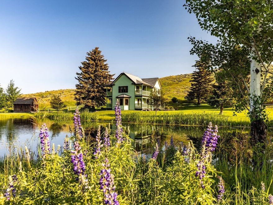 Porcupine Creek Homestead is made up of 116± acres located in the coveted Shields River Valley east of the small town of Wilsall and an hour from Bozeman. The property is a blend of cottonwood and aspen grove riparian areas bifurcated by small flowing springs, two ponds, and valley views that encompass the Crazy Mountains to the east and the Bridger Range to the west. Once owned by a prominent Livingston banker, he built the historic Victorian-style home, which became the centerpiece of the property. In 2005, a restoration project began, and the house was effectively recreated to its exact dimensions and vernacular. This small two-bedroom one-and-a-half bath was masterfully re-created and appointed in a charming way. A six-stall horse barn was added near the residence with a large two-bedroom apartment that lofts overhead and sits next to a spacious two-car garage. Several years ago, a large trout pond was created for aesthetic and recreational purposes with a secondary primary building site in mind. The property is well-kept, and the hayfield is managed appropriately to produce forage crops and attract the multitude of wildlife that exists there, including whitetail deer and moose. Porcupine Creek Homestead is an easy-to-own property with nicely appointed improvements in proximity to Bozeman, Livingston, skiing, and the lively aspects of these desirable mountain communities, yet far enough away to find solitude in a highly sought-after river valley.