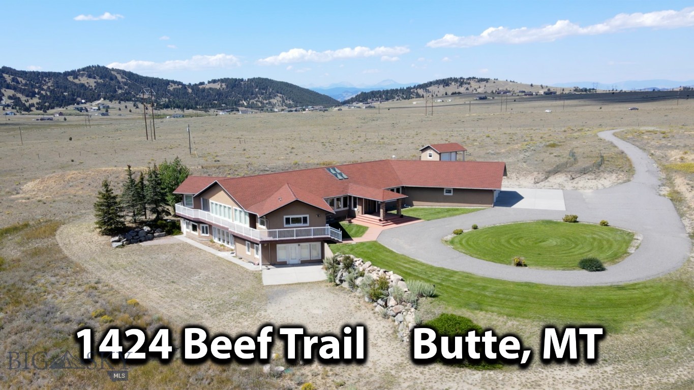 Presenting a Montana masterpiece that is tucked away on 65 acres and is surrounded by The Rocky Mountains. It offers a perfect mix of having "plenty of elbow room" but still being only minutes to town (Butte) on maintained roads. As you approach this unique property, a sense of anticipation fills the air knowing you are about to enter a realm of enchantment—a place where privacy reigns supreme and breathtaking vistas unfold before your eyes. A grand foyer welcomes you into a luxurious and elegant house with architectural features and ornamentation that make this estate extra-special. Step into any room and you will be greeted by spectacular panoramic views of the majestic mountain ranges. The heart of the home holds a walk-in atrium that exudes soothing energy tranquility. Multiple primary suites, each with its own walk-in closet, provide comfort and privacy. The basement is a walk-out and an elevator is available to get you from floor to floor. The wrap around deck allows a seamless transition from the indoor to outdoor the spaces. 3-car attached garage. For those who cherish the equestrian lifestyle, a charming horse barn and corral await. Southwest Montana is rich in recreation, wildlife and scenery and this magnificent property was built for comfort, privacy, and total enjoyment of life!