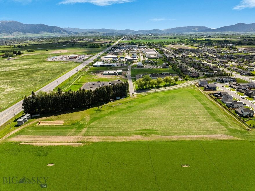 Excellent development land with Huffine frontage.  This 8 acre parcel is County zoned M-I to allow for a multitude of uses.  Lot is in the growing Woodland Park subdivision, and sits on the corner of Red Mountain Drive and Huffine for premier visibility.  There is a farmhouse, detached garage and shed on the property that convey with the sale.  There is an access easement for Haley Springs Road through the property that will create more localized visibility in addition to the heavy visibility on Huffine.