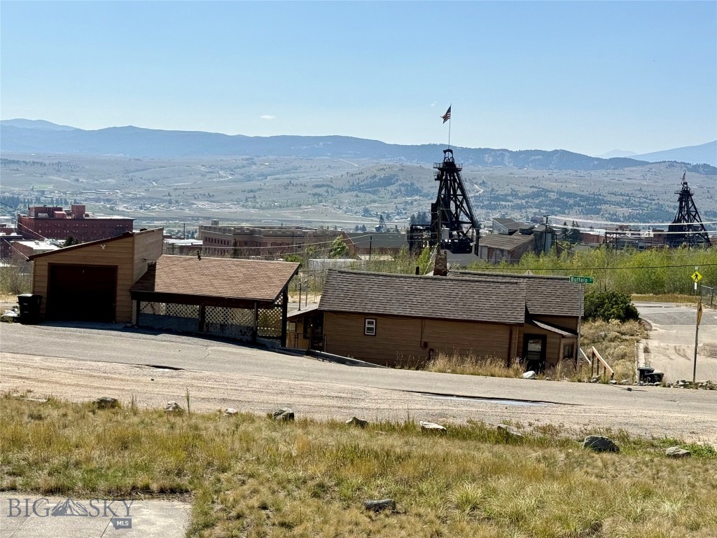 Charming 3-bedroom, 1-bath home with a 1-car garage and shop below, perfect for projects or extra storage. Relax outdoors on the covered patio with hot tub hookups, while soaking in the endless views. 10-minute walking distance to the Original Mine and historic Uptown Butte, and minutes from the Top of the World Trail System, BA&P Hill Trail, which stretches all the way to Rocker. This home combines convenience, recreation, and fabulous views in one ideal location. A rare opportunity to enjoy history, recreation, and views from one​​‌​​​​‌​‌​​​​‌​​‌​​​​‌‌ spot!