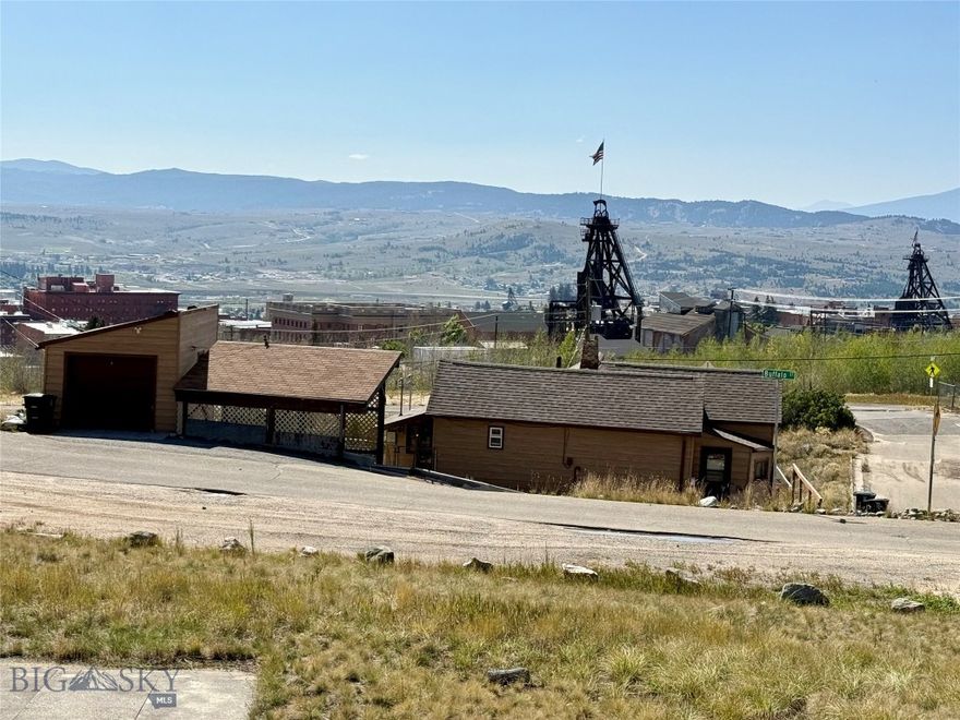 Charming 3-bedroom, 1-bath home with a 1-car garage and shop below, perfect for projects or extra storage. Relax outdoors on the covered patio with hot tub hookups, while soaking in the endless views.  10-minute walking distance to the Original Mine and historic Uptown Butte, and minutes from the Top of the World Trail System, BA&P Hill Trail, which stretches all the way to Rocker. This home combines convenience, recreation, and fabulous views in one ideal location.  A rare opportunity to enjoy history, recreation, and views from one​​‌​​​​‌​‌​​​​‌​​‌​​​​‌‌ spot!