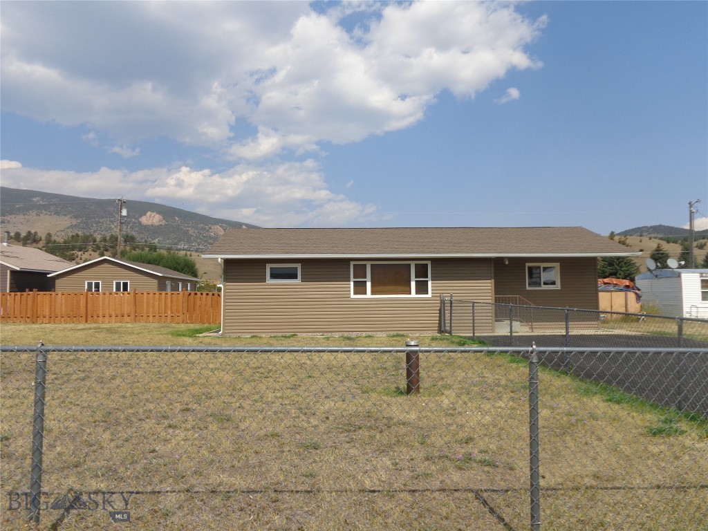 Very well maintained three-bedroom, two-bathroom home west of Anaconda with large partially fenced yard and oversized two-car detached garage. Other features include open concept living on one floor, kitchen with oak cabinets and eating counter, upgraded electric and hot water heat, paved driveway and view of the local mountains.