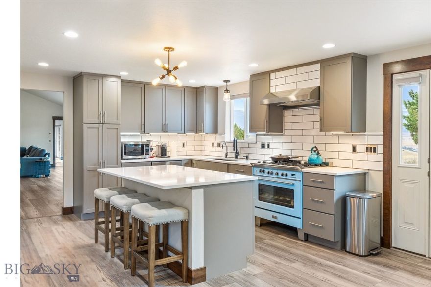 Experience Paradise Valley at its finest! This exceptional property features a beautifully renovated 3-bedroom, 2-bath, 3,200-SQFt home; a massive 2,000-SQF temperature-controlled shop; 2 custom cabins & a private lot w/unobstructed views of Paradise Valley's Absaroka Mountain Range! In addition, this home has been newly renovated w/a sophisticated-vintage design that seamlessly blends clean, modern lines w/high-end materials. The kitchen is a true SHOWSTOPPER, w/marble-inspired quartz countertops, great cabinet & counter space, a large island & premium appliances! - You'll love the vintage-inspired Verona gas range in a vibrant blue. Open concept living & dining areas feature vaulted ceilings & oversized glass doors that flood the space w/natural light & endless mountain views. The living room is warm and inviting, w/a retro vibe inspired by the cast-iron gas stove w/its natural stone surround! The private master bedroom w/a spa-like ensuite offers an oversized soaking tub, a walk-in shower, a generous closet space & its own hot water on-demand system. The west wing of the house is built into the hillside & offers great storage & pantry space; a stylish 3/4 bath w/custom tile; an office space / family room; laundry area w/a stackable washing machine & dryer & 2 additional bedrooms & access to the basement. The basement is a versatile 700-SQF space that includes water, upgraded electrical services & a private exit that opens to the lower lot!  On the lower lot, two custom cabins built w/reclaimed lumber, metal roofs, covered porches & private driveway access are ready for your finishing touches! The 2,000-SQF shop is fully equipped w/state-of-the-art heating, cooling & electrical systems, making it ideal for multiple purposes —the small town of Emigrant, Montana, has it all - a grocery store, a local bank, a post office, fly shops, restaurants, bars & a vibrant local scene w/live music at the historic Old Saloon!. In addition, Emigrant offers endless adventures on the Yellowstone River & a five-star restaurants  at Chico Hot Springs and Sage Lodge & is just 30 minutes from Yellowstone National Park & 20 minutes to the lively town of Livingston, Montana! SELLER FINANCING AVAILABLE!