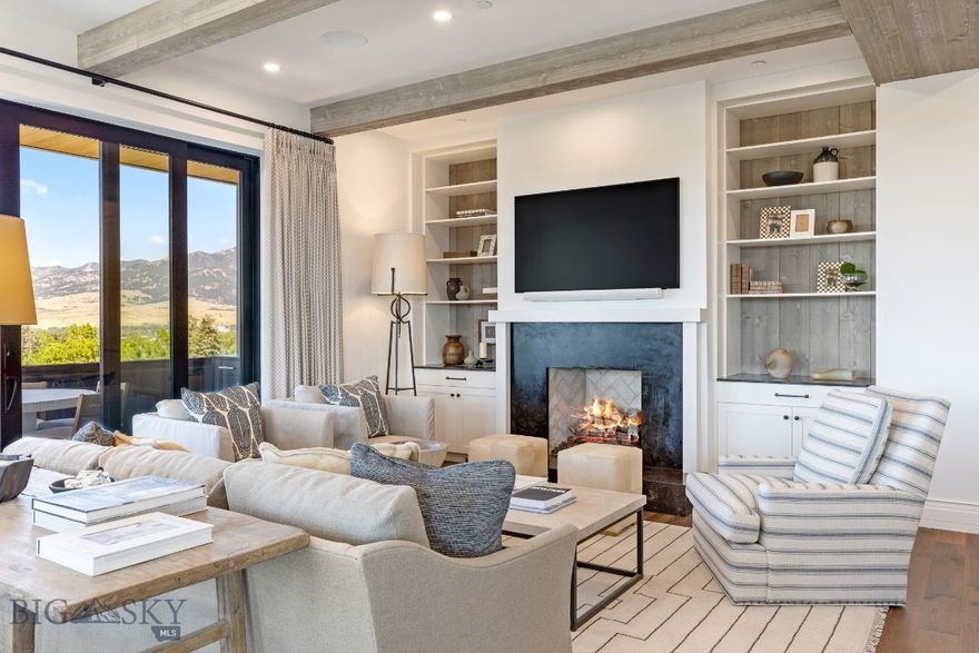 Welcome to The Henry, Bozeman’s premier luxury landmark, where this sixth-floor penthouse stands as a fully custom masterpiece of urban sophistication. This expansive 3-bedroom, 3.5-bathroom residence is the building’s crown jewel, boasting a bespoke interior design and high-end finishes that elevate it far beyond the standard offering. The open-concept living area, defined by soaring ceilings and floor-to-ceiling windows, flows seamlessly onto a grand private balcony perfect for entertaining, while the primary suite serves as a secluded sanctuary with its own secondary private terrace. Each spacious bedroom features a dedicated en-suite bath, providing ultimate privacy for residents and guests alike. Situated just two blocks from the vibrant boutiques and culinary scene of downtown Bozeman, this meticulously crafted penthouse offers a rare blend of custom luxury and mountain-modern elegance in the heart of the city’s most sought-after address.