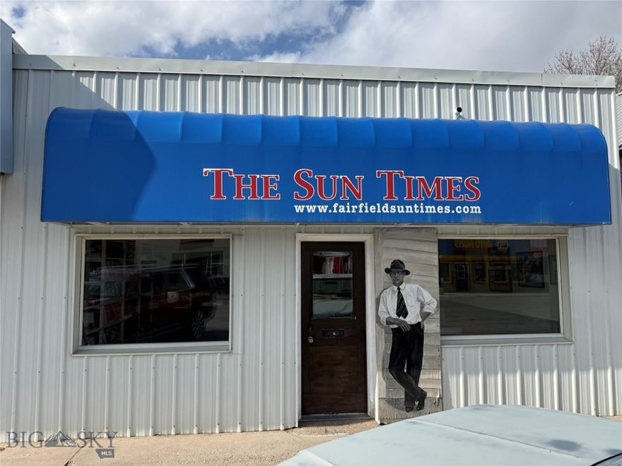 Have you ever dreamed of owning and publishing a small-town newspaper while also investing in a highly visible Main Street property in rural Montana? This is a rare opportunity to purchase The Times Leader along with the building that serves as its headquarters in the heart of Fairfield, Montana. What is now The Times Leader has evolved from The Fairfield Sun Times, The Sun Valley Sun and the Fairfield Times, originally established in 1916. Small towns remain incredibly loyal to their local newspapers, and this publication enjoys strong community support throughout the region. Since taking over in 2007, the seller has grown the paper to approximately 430 subscribers with distribution reaching Augusta, Fairfield, Choteau, Sun River, Simms, Vaughn and Great Falls. Advertising revenue has historically been strong, at times reaching as much as 80 percent of the paper’s income. In addition to the regular publication, the business produces specialty editions and programs for local events including the Augusta Rodeo, graduations and swim day, along with printing services such as NCR forms, custom envelopes and carbon forms. Additional revenue is generated through an association with newspapers.com, which catalogs newspapers. The sale includes office furniture, shelving, equipment and supplies necessary to continue operations, including a Risograph G3750, Martin Yale paper folder, paper drill, bindery stapler, padding machine, paper cutter, plastic binder, microfilm reader and bound historic editions of the Fairfield Sun Times, Sun Valley Sun and Wheat Center Newspaper. Seller is willing to assist with the transition to help a new owner step into the business smoothly. The building itself offers a prime Main Street location and was built in 1964. Inside the approximately 2,300-square-foot building, you’ll find a reception area with metal wainscoting and built-in shelving, two offices, storage space, a large flex room, a full bathroom with tub and shower, and an oversized garage with access to owned alley parking. Flooring is sturdy carpet and concrete, and portions of the roof and siding are metal. Fairfield is an incorporated city and this property is located in Zone 6. Unlike many neighboring communities, Fairfield allows commercial properties to be converted to residential use, opening the door to mixed-use possibilities, residential conversion, business-only use or even a nightly rental opportunity in a town with limited lodging options.