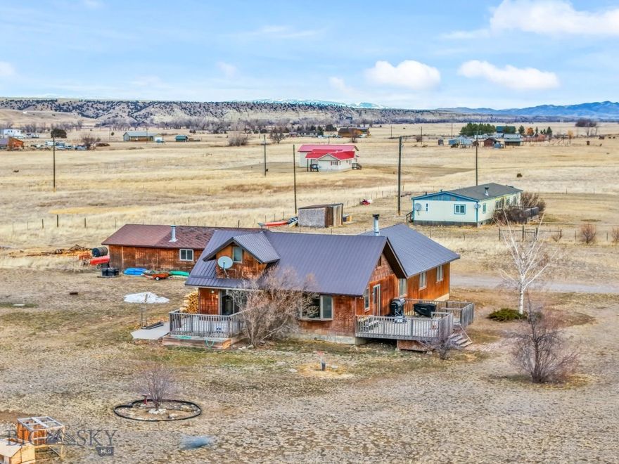 PRICE DROP – FLEXIBLE LIVING & HIGH-INCOME POTENTIAL ON 10+ ACRES!

This unique 10.03-acre property near the Madison River in Three Forks offers the best of both worlds: versatile living options and strong investment potential—all just a scenic drive from Bozeman. The 2,000 sq. ft. main home features 4 beds, 2 baths, a cozy wood-burning fireplace, dual decks, and a loft—ideal for owner occupancy, long-term rental, or vacation guests. Wildlife sightings are a regular delight, with deer and elk often passing through. A second 1,500 sq. ft. mobile home includes 3 beds, 2 baths, and a dedicated office space—perfect for a second rental unit, guest housing, or multigenerational living.

Both homes are approved for short-term and long-term rentals, allowing you to generate income immediately or adapt your rental strategy to seasonal demand. Live in one and rent the other—or lease both for maximum return. Also included is a 1,000 sq. ft. heated workshop with a wood-burning furnace and an air compressor—a great opportunity to add value with a business component or workshop lease.

With close access to world-class fly fishing, hunting, and year-round recreation, this property blends sought-after Montana living with reliable revenue opportunities—now offered at a reduced price!