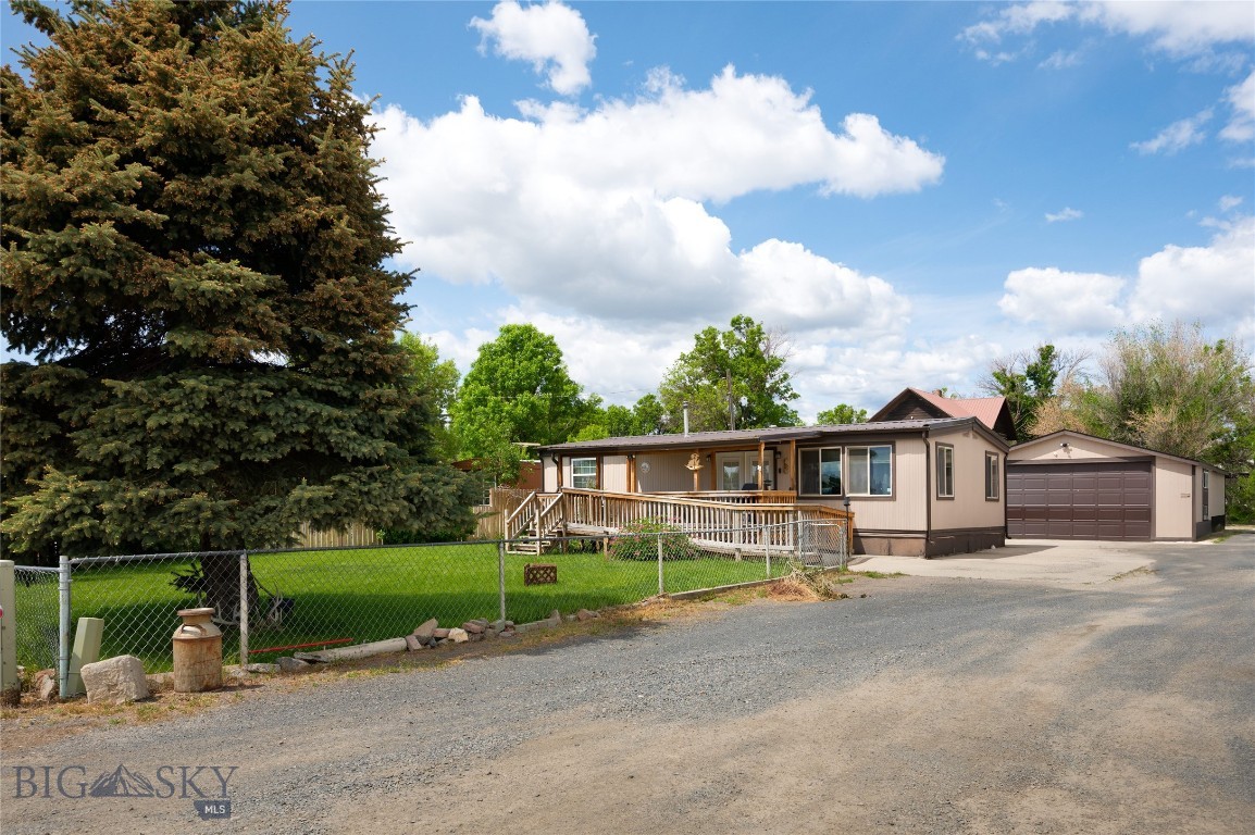 This is an incredible opportunity to own your own home in the quaint community of Whitehall, MT. Handicap accessible throughout and easy one level living. One large bedroom with abundant natural light with an extra sitting area. Sheetrock walls throughout, laminate flooring, pellet stove, and roll in shower. The kitchen features tile floor, countertops and updated cabinets with some pullouts. A bonus room, which could be an additional bedroom, has several windows making it bright and cheery. A covered deck in the front yard with wheel chair ramp. In addition there is a 20x25, detached 2 car garage with overhead door opener. The yard is fully fenced and landscaped with underground sprinkler system and well established perennials. Boarders an open field to east and privacy on a dead end street. New school and the local pool right down the road. Easy commute to Bozeman or Butte.
