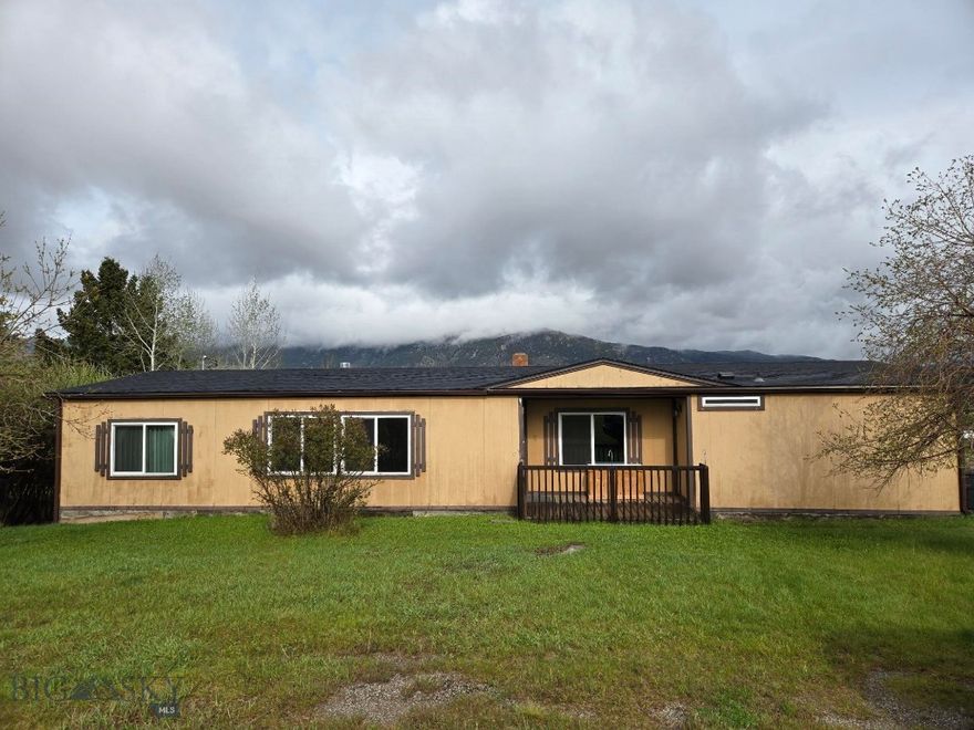 Very well maintained wide manufactured home on just over 1 acre!!!  New flooring, newer windows, roof and furnace as well!  
Great investment property!
3 bedrooms, 2 full baths, laundry room, living room, dining room and attached deck make this a great family home as well.
Home will not finance through Conventional, VA, FHA, or RD as it is not de-titled and not on a permanent foundation.