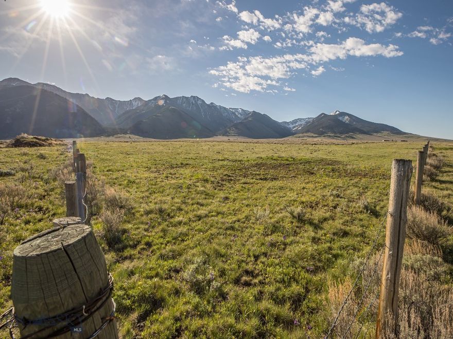 Located just 3.4 miles south of the storied Madison River and the Raynold's Pass fishing access, with no covenants or zoning, this 80 acres is a blank slate for your dreams! Fabulous trout fishing on the Madison River and multiple nearby lakes, including Cliff and Wade Lakes, Hebgen Lake, Quake Lake, Henry's Lake and Yellowstone Lake make this an angler's haven.  The huge local elk population, along with deer and big horn sheep also makes this a terrific hunter's basecamp. This property boasts panoramic views of show-capped mountain ranges and the expansive sky that make Montana famous. 

Views to the west are protected by conservation easement on the Three Dollar Ranch. Another large nearby ranch is also in conservation easement, which will greatly restrict sprawl and enhance wildlife migration in the area.

This unique property enjoys approximately 1,350 feet of frontage along MT HWY 87 and year-round access via the already installed and MDOT approved entrance.

Just 45 miles to Ennis and 27 miles to the West entrance of Yellowstone National Park. The airport in West Yellowstone is only 28 miles away for non-winter commercial flights and the Ennis/Big Sky Airport is 40 miles away for private aviation. More flights year-round are available in Bozeman, which is 98 miles away.