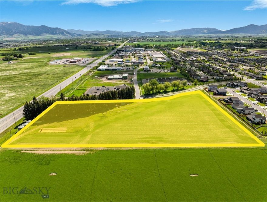 Excellent development land with Huffine frontage.  This 8 acre parcel is County zoned M-1 to allow for a multitude of uses.  Lot is in the growing Woodland Park subdivision, and sits on the corner of Red Mountain Drive and Huffine for premier visibility.  There is a farmhouse, detached garage and shed on the property that convey with the sale.  There is an access easement for Haley Springs Road through the property that will create more localized visibility in addition to the heavy visibility on Huffine.