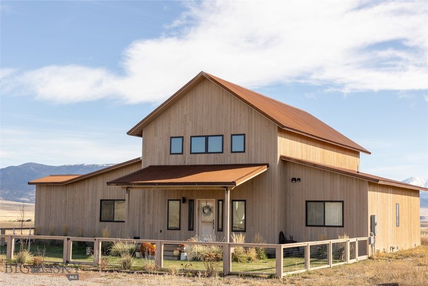 Welcome to your Montana retreat, where expansive acreage, refined comfort, and the quiet luxury of Big Sky Country converge. Set in the heart of the Madison Valley, this exceptional property offers a rare opportunity to embrace a more intentional way of living—one defined by open space, privacy, and understated elegance. Here, mornings begin with a cup of coffee overlooking sweeping mountain vistas, and evenings unfold beneath a canopy of stars, far removed from the pace of city life.From its elevated setting, the home captures panoramic views of rolling meadows and surrounding ranges, delivering a sense of scale and serenity that is increasingly difficult to find. Inside, the residence is thoughtfully designed with a balance of sophistication and warmth—featuring natural light-filled spaces, clean lines, and quality finishes that create an atmosphere both inviting and elevated. Expansive windows frame the landscape as living art, while the open-concept design allows for seamless entertaining and relaxed daily living.The kitchen anchors the home with both style and function, offering generous space for hosting intimate gatherings or larger occasions, complemented by well-appointed living areas that provide a refined yet comfortable setting to unwind. Bedrooms serve as private retreats, designed with a sense of calm and proportion that reflects the surrounding environment.For those drawn to an equestrian lifestyle or refined outdoor pursuits, the acreage provides ample opportunity for horses, private riding, and curated recreational experiences. This is a property that supports both leisure and legacy—whether that means morning rides across open pasture, fly fishing on nearby blue-ribbon waters, or simply enjoying the stillness of a preserved landscape.The community reflects a discerning yet grounded lifestyle, where neighbors value privacy, stewardship of the land, and a connection to local agriculture..Located a short drive from Ennis, the property provides convenient access to fine dining, boutique shopping, and the renowned Madison River, while maintaining a sense of seclusion that defines premier Montana living. Whether envisioned as a full-time residence, seasonal escape, or generational holding, this is a place where luxury is measured not only in finishes, but in space, quiet, and the enduring beauty of the land itself.