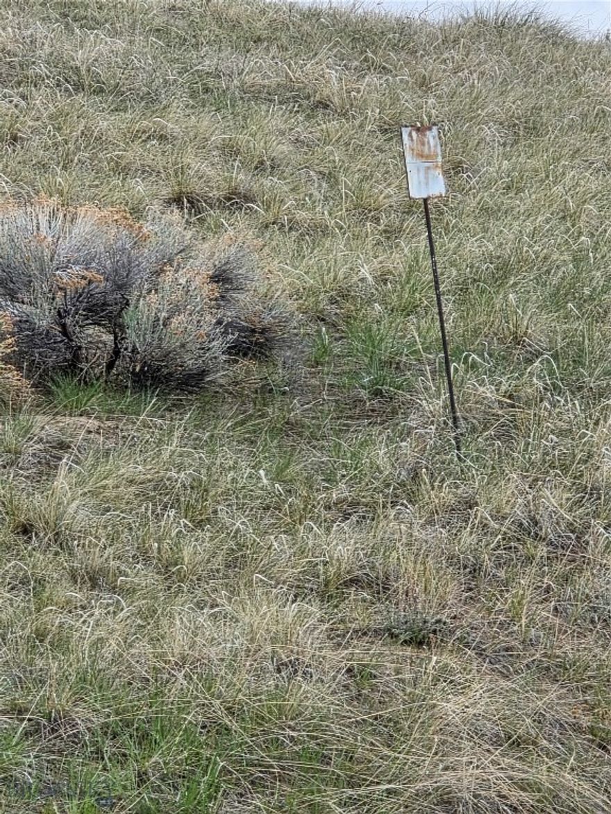 This land has easy access with maintained roads in the Pioneer Lookout Subdivision with fencing on one side.  The 11.8 acres has 2 private wells with one Well log, and power to the property. The driveway access is in, rolling topography with a chose of building sites.  The HOA maintaines the roads and  the snow removal .  This location is close to town and you will enjoy the views, peace and quiet and your chose to place your Montana home.