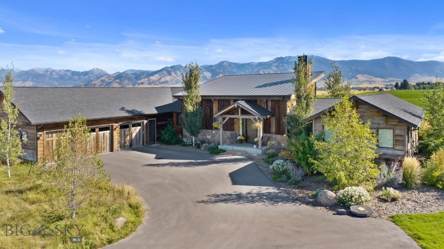 Welcome to this stunning, architecturally designed home, featured in the prestigious *Parade of Homes*. Set on over 7 fully fenced acres, this home blends luxurious living with rural charm, all just minutes from shopping, dining, and outdoor adventure.

Step inside the open-concept, single-level layout where soaring ceilings and reclaimed wood beams greet you in the great room, flooded with natural light from expansive windows. The wood-burning fireplace creates the perfect ambiance for chilly nights, while the white oak floors and reclaimed wood accents add warmth and character throughout.

This 5-bedroom, 4-bath home boasts a full guest suite, plus an additional library or media room. Custom tile work in every bathroom, quartz countertops, and luxurious finishes elevate the living experience. The vaulted master suite offers a spa-like retreat with its custom Native Trails soaking tub and sinks, providing ultimate relaxation.

The chef’s dream kitchen is equipped with high-end Viking appliances, quartz countertops, and an expansive pantry, making it perfect for culinary creations and entertaining. 

Energy efficiency is a top priority with foam-insulated exterior walls, multiple HVAC systems, and central air conditioning. The oversized 3-car garage offers ample space, while the large covered patio invites you to unwind in the hot tub and take in the breathtaking Bridger Mountain views.

The property also includes a fully insulated and heated 40’ x 60’ shop with large doors, perfect for storing all your toys or for your next project.  Whether your passion is classic cars, wood working projects, or just need storage, this shop is a dream come true.

In addition to the home and shop, there is the newly constructed “Guest Barn”.  This building has 1,360 square feet of fully finished space on the main level.  It has a kitchen, two bathrooms, durable LVT flooring, and a world of possibilities.  The upper level is a fully finished 1 bedroom, 1 bathroom guest apartment with outstanding views and abundant natural light. 

Horse lovers will appreciate the cross-fenced acreage, perfect for horses or livestock. With nearby access to the Bridger Mountains for hiking and skiing, this home offers the perfect balance of luxury, functionality, and natural beauty.

Don’t miss your opportunity to own this one-of-a-kind property that seamlessly blends architectural elegance with rural tranquility.