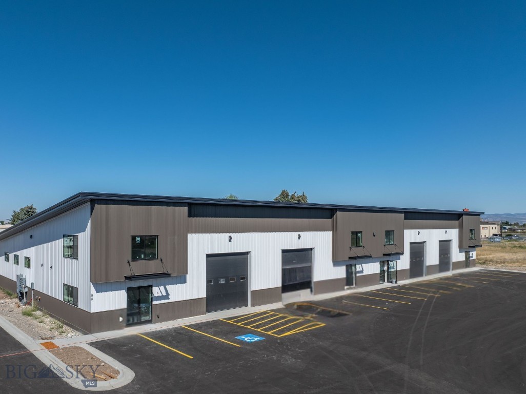 Introducing a brand-new 4,160 SF warehouse located in Belgrade’s sought-after West Post development. Thoughtfully designed to meet a wide range of commercial or light industrial needs, this property offers a 26’ peak ceiling height, providing exceptional vertical clearance and flexibility for storage or operations. A carpeted mezzanine office space creates a comfortable setting for day-to-day business functions, while the bathroom adds convenience for staff and clients. The building is equipped with 3-phase power and features both a 14’ front-facing overhead door for easy customer or equipment access, as well as a 10’ rear overhead door and 50 feet of dedicated yard space for versatile loading and logistics. This warehouse has quick and convenient access to I-90 and Jackrabbit Lane.