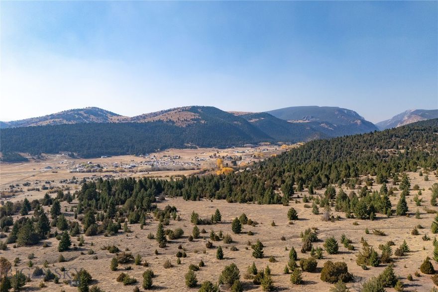Nestled in the breathtaking Lost Creek area of Anaconda, this expansive 117 +/- acre property offers endless possibilities for those seeking the perfect blend of Montana’s rugged beauty and versatile potential. With varied terrain and borders touching public lands on multiple sides, the property provides unmatched access to outdoor recreation, including hiking, hunting, and exploring the surrounding wilderness.
Located just minutes from Lost Creek State Park, you’ll find dramatic limestone cliffs, cascading waterfalls, and abundant wildlife right at your doorstep. Nearby attractions include the renowned Fairmont Hot Springs Resort, the historic charm of downtown Anaconda, and year-round recreational opportunities like golfing at the Old Works Golf Course and skiing at Discovery Ski Area. Whether you’re looking to build a legacy ranch, develop a unique subdivision, or simply enjoy the serenity of Montana’s natural beauty, this property offers a rare opportunity to bring your vision to life.
Don’t miss your chance to own a piece of Lost Creek’s unparalleled landscape. Contact us today for more information or to schedule a tour!