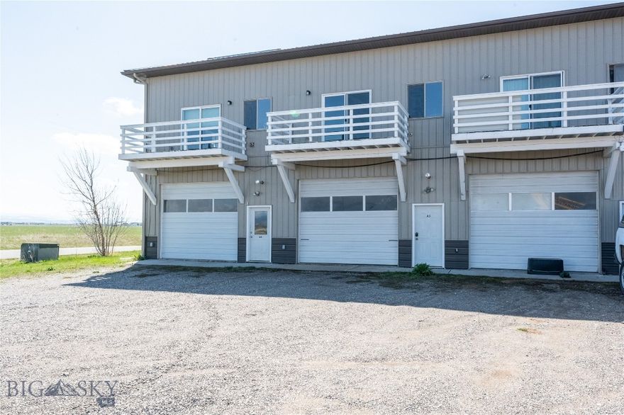 Welcome to this exceptional commercial condo that perfectly blends comfort and functionality, nestled amidst stunning views of the Bridger Mountains. This unique property boasts an impressive 39' x 14' shop, ideally suited for a variety of commercial uses, making it a rare find in today's market. Step inside and discover the thoughtfully designed office space located on the upper level, offering a productive work environment that takes advantage of natural light and captivating mountain views. The east-facing deck provides a serene spot to enjoy your morning coffee, all while soaking in the beauty of the landscape. This property is a dream for hobbyists and enthusiasts alike, with ample storage for vehicles, trailers, campers, and all your favorite work items. The 12" garage door ensures easy access, allowing you to conveniently store your belongings without any hassle. With its prime location near the airport, you’ll appreciate the ease of travel and close proximity to amenities, all while enjoying the peaceful ambiance of the surrounding area. This condo is an excellent opportunity for those seeking a versatile space that accommodates both personal and professional pursuits. Don’t miss your chance to own this remarkable property. Schedule your showing today and envision the possibilities that await in this extraordinary space.