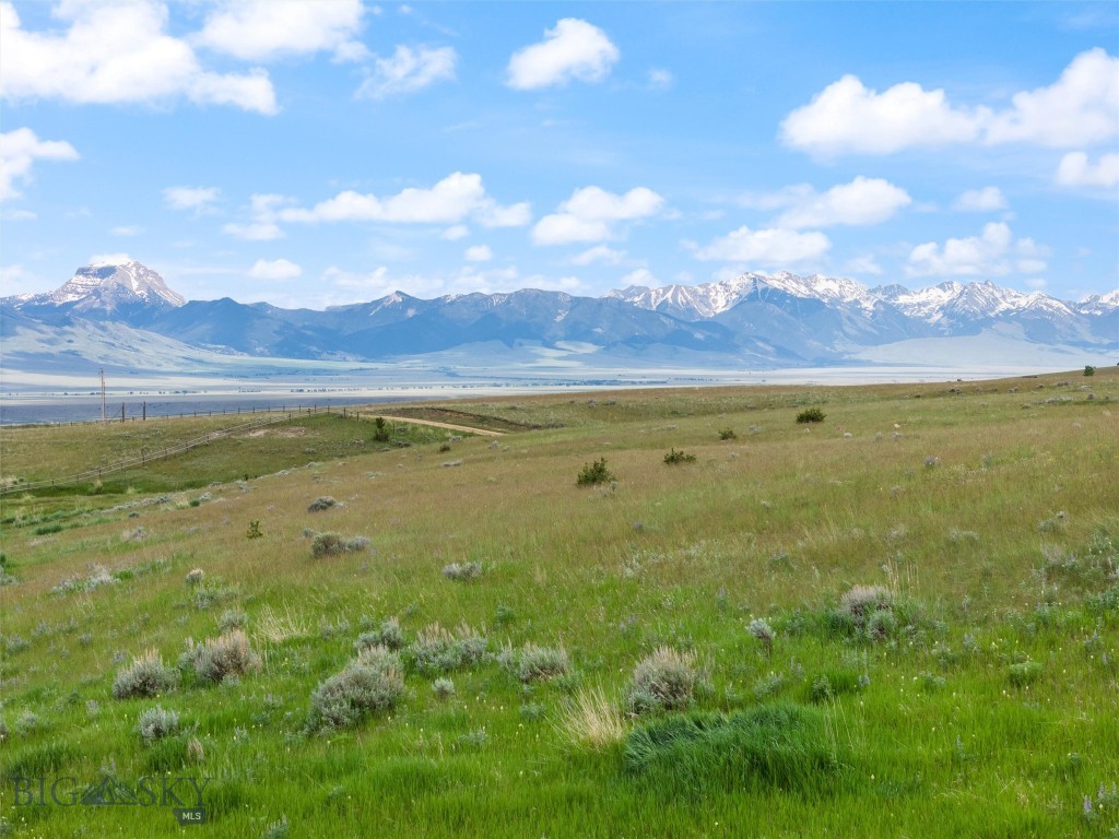 Unmatched Madison Range views with BILLY CREEK running through the eastern boundary with water rights and TRAIL CREEK meandering through the northern boundary! This 7.679 acre lot is a perfect location to build your Montana home. This property is located towards the end of the road for additional privacy. For the outdoor enthusiast, this property is situated close to recreation including fishing, hunting, hiking, biking, horseback riding, and ATV trails. Just 10 mins to the lively western town of Ennis, experience the friendliness of a small-town community while having the convenience of local amenities, shops, a golf course and dining options.