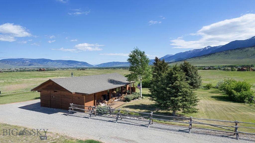 Beautiful 20+ acres located in the incredible Paradise Valley with sweet ranch style cabin right beneath the Absaroka mountains. Located on private road with landscaped yard, trees and 360 degree mountain views. Come enjoy all Montana has to offer with hop, skip, and jump to Bozeman, Livingston, Yellowstone River and Yellowstone National Park. Enjoy all your favorite outdoor activities including hiking, fly fishing, skiing, rafting, big game hunting and all the local restaurants. Neighborhood includes all 20+ acres lots with no HOA. Enjoy peace and quiet and all that Montana has to offer. Custom-built home with large beams in kitchen and living room, well-insulated for winter months with wood burning fireplace and large outdoor deck for BBQ's. Perimeter fenced with buck & pole fencing.
This property is Broker owned and Broker will be present for all showings. This property is on a private road that is maintained by all the property owners with no CCR'S or Deed restrictions.