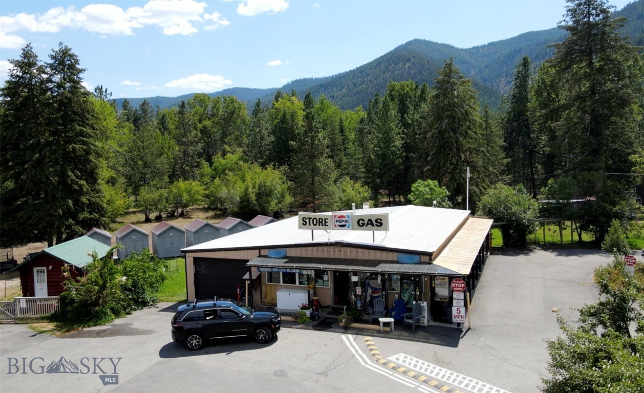 Don't miss this opportunity to own the Turah RV park, store, cabin rentals, tent sites and mini storage! Located just 12 minutes East of Missoula, MT with easy access on and off of I-90. This 6.25 acre property is turnkey and up and running with great revenue. This property has a beautiful setting with mature trees, playground and well maintained common areas. The new owner could live on-site in the 1 bed, 1 bath self-contained apartment or take over one of the many campsites or cabins. Below the apartment and store is a large, unfinished basement for future living spaces or storage. The RV park has 14 pull through sites and 12 back-in sites, 10 tent sites, 6 dry cabin rentals, shower/laundry facility 19 small storage shed rentals, two 10'X20' sheds, one 20'X30' shop/garage with two bay doors. There is an RV dump station located on site, as well as a large propane tank for filling guests and smaller tanks. There is a beer and wine license for the convenience store. Also included in the sale is a John Deere mower, golf cart and Kubota side by side with plow. Convenience store inventory sells with the property. Owner financing may be considered with a full price offer and/or adequate down payment. Public access to the Clark Fork River is right across the street. Showings by appointment only.