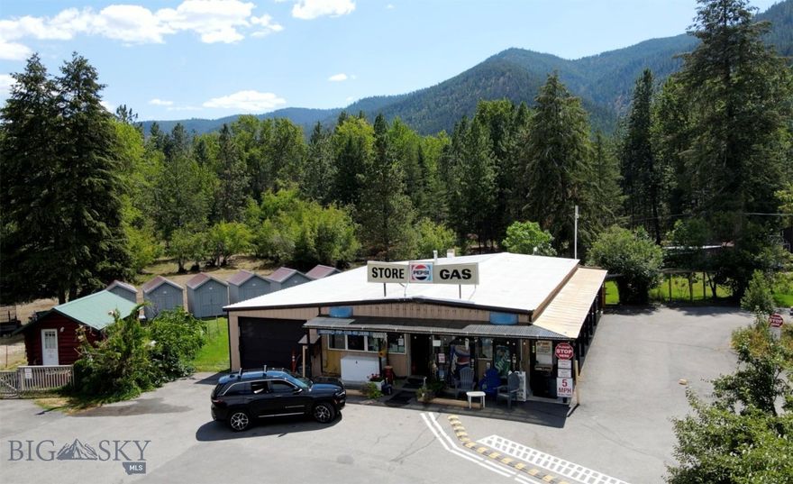 Don't miss this opportunity to own the Turah RV park, store, cabin rentals, tent sites and mini storage! Located just 12 minutes East of Missoula, MT with easy access on and off of I-90. This 6.25 acre property is turnkey and up and running with great revenue. This property has a beautiful setting with mature trees, playground and well maintained common areas. The new owner could live on-site in the 1 bed, 1 bath self-contained apartment or take over one of the many campsites or cabins.  Below the apartment and store is a large, unfinished basement for future living spaces or storage. The RV park has 14 pull through sites and 12 back-in sites, 10 tent sites, 6 dry cabin rentals, shower/laundry facility 19 small storage shed rentals, two 10'X20' sheds, one 20'X30' shop/garage with two bay doors. There is an RV dump station located on site, as well as a large propane tank for filling guests and smaller tanks. There is a beer and wine license for the convenience store. Also included in the sale is a John Deere mower, golf cart and Kubota side by side with plow. Convenience store inventory sells with the property. Owner financing may be considered with a full price offer and/or adequate down payment.  Public access to the Clark Fork River is right across the street. Showings by appointment only.