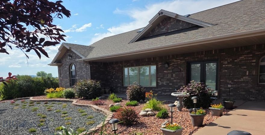 The seller loved the stone counters, open living spaces, natural light from skylights, bonus rooms, and a large garage. 
Sunlight pours through new Pella skylights, windows, and doors, brightening every room. The main floor flows from a spacious kitchen with stone counters, island, and pantry into a living area ideal for hosting or relaxing. The great room offers vaulted ceilings and a Valor gas stove, with floor-to-ceiling doors and windows showcasing sunrise and sunset views and leading to a walk-out patio. Upstairs, a loft fits a queen bed, with bonus rooms, walk-in closet, and bath with easy-access shower. The oversized three-bay garage fits five vehicles and has a temperature-controlled shop. Outdoors, enjoy a fenced yard, gazebo, two patios, a fire pit, and low-maintenance landscaping designed for entertaining and enjoying quiet moments. Info deemed reliable but not guaranteed. Buyer/agent to verify.