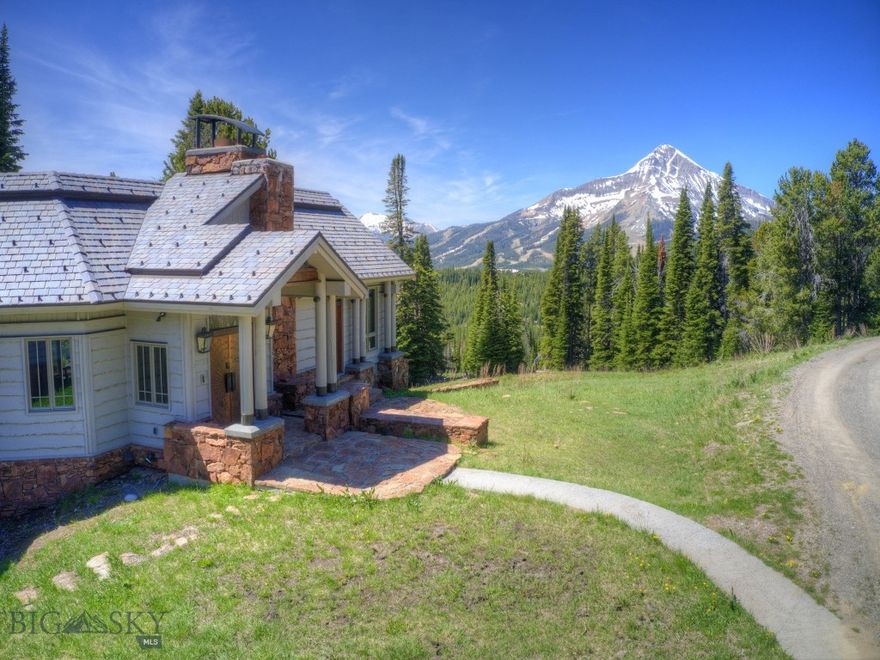 This Upper Beehive residence offers a unique opportunity for those who cherish outdoor activities and stunning natural surroundings. Situated with convenient access to backcountry skiing, hiking, and biking, it promises an adventurous lifestyle right at your doorstep. The home itself is distinguished by its grand vaulted ceilings and expansive floor-to-ceiling windows, which not only bring in abundant natural light but also seamlessly integrate the outdoor beauty into the living spaces. Panoramic views of iconic landmarks such as Lone Mountain, Sphinx Mountain, and Pioneer Mountain can be savored from various vantage points within the residence, enhancing the connection with the surrounding landscape. Evenings bring the enchantment of starry skies, perfect for those who appreciate the tranquility and magic of Montana nights. Thoughtful design and meticulous appointments throughout the property ensure that every aspect of comfort and luxury is met. Spanning over 40 acres, the property offers ample privacy and the potential to expand with the option to develop the adjacent lot. Despite its secluded feel, the location remains convenient, being only 3.8 miles away from the renowned Big Sky Resort, providing access to world-class skiing and other amenities. Sold partially furnished, this home is move-in ready, inviting new owners to immediately immerse themselves in the Big Sky lifestyle. This property is a retreat from the ordinary, offering not just a home but an entire lifestyle defined by adventure, privacy, and the natural beauty of Montana's landscapes.