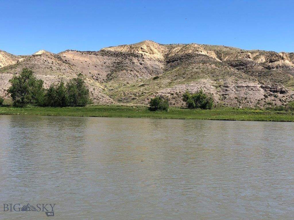 10 Acres of Missouri River frontage with fishing, boating, hunting, and power with BLM land across the river out in the country between Great Falls, Montana, and Fort Benton, Montana. Land in Montana on the banks of the Missouri River isn’t easy to come by. This is your chance to own Missouri River frontage out in the countryside of Montana. It bears repeating that this property has Missouri River frontage! This amazing Montana property borders the Missouri River for 333 feet and gives you approximately 10 acres of land you could build your Montana cabin or home on. You’ll have the mighty Missouri River right out your front door to see, hear, and go fishing or boating any time you want. The Missouri River is known for its renown trout, walleye, and pike fishing among other fish like small mouth bass, carp, catfish, and more. By owning river frontage, you’ll have easy access to the river to enjoy day in and day out. Just step out the front door of your cabin with your fishing pole in hand and take to the river for relaxation and fun as you catch the big ones in the waters of the Mighty Mo (Missouri). There are geese, ducks, other waterfowl, and bald and golden eagles that all use this stretch of the Missouri River for the valuable food and water it provides. The eagles can be seen gliding along the banks of the Missouri River looking for food or soaring along the bluffs on the opposite side of the river, making it seem so effortless to look down on everything from above. The deer and antelope in the area also use the river for the valuable water and nourishment it provides. That is evidenced by the trails you can see on the bluffs across the river on the BLM land there. You can watch them from the cabin on your property, and during hunting season, you can hunt that BLM land that borders your land just across the river. In fact, they’ll be within range during the general hunting season as they come down to water at the river. Just wait and watch them from your picture windows. And if that’s not enough, the access road leading to the property goes through BLM land, which you can hunt and hike on, too. There are plenty of other BLM and state lands in the area, as well as block management areas that are open to hunting on private lands. The area is also well known for its fantastic pheasant and upland game bird hunting. You’ll see pheasants just standing along the roads leading to your property on the Missouri. You can’t go wrong with this one.