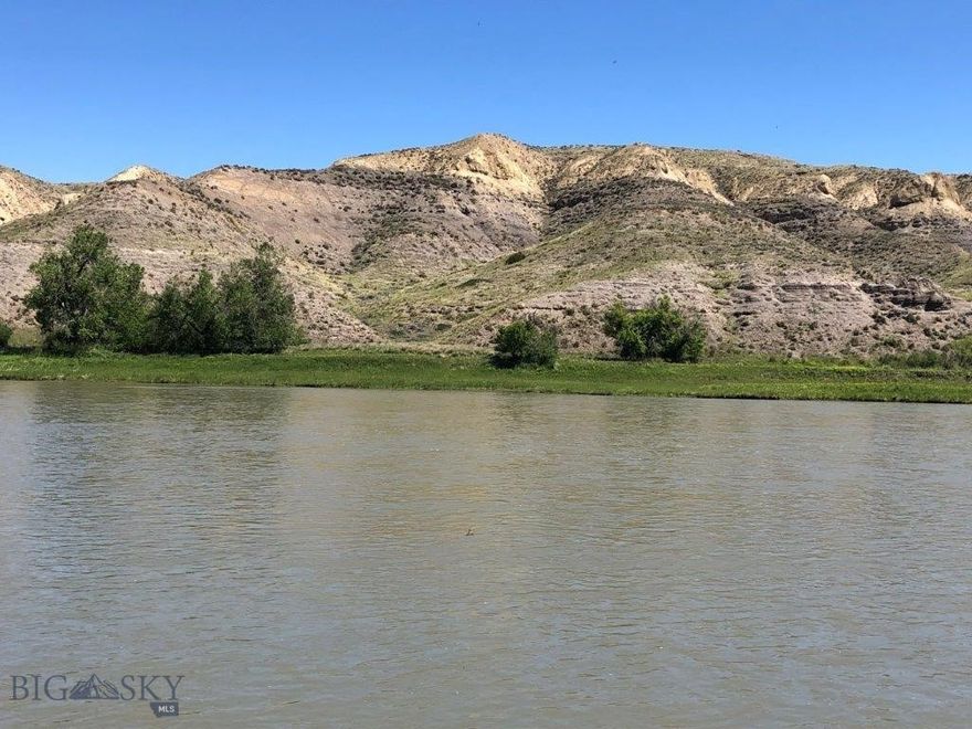 10 Acres of Missouri River frontage with fishing, boating, hunting, and power with BLM land across the river out in the country between Great Falls, Montana, and Fort Benton, Montana. Land in Montana on the banks of the Missouri River isn’t easy to come by. This is your chance to own Missouri River frontage out in the countryside of Montana. It bears repeating that this property has Missouri River frontage! This amazing Montana property borders the Missouri River for 333 feet and gives you approximately 10 acres of land you could build your Montana cabin or home on. You’ll have the mighty Missouri River right out your front door to see, hear, and go fishing or boating any time you want. The Missouri River is known for its renown trout, walleye, and pike fishing among other fish like small mouth bass, carp, catfish, and more. By owning river frontage, you’ll have easy access to the river to enjoy day in and day out. Just step out the front door of your cabin with your fishing pole in hand and take to the river for relaxation and fun as you catch the big ones in the waters of the Mighty Mo (Missouri). There are geese, ducks, other waterfowl, and bald and golden eagles that all use this stretch of the Missouri River for the valuable food and water it provides. The eagles can be seen gliding along the banks of the Missouri River looking for food or soaring along the bluffs on the opposite side of the river, making it seem so effortless to look down on everything from above. The deer and antelope in the area also use the river for the valuable water and nourishment it provides. That is evidenced by the trails you can see on the bluffs across the river on the BLM land there. You can watch them from the cabin on your property, and during hunting season, you can hunt that BLM land that borders your land just across the river. In fact, they’ll be within range during the general hunting season as they come down to water at the river. Just wait and watch them from your picture windows. And if that’s not enough, the access road leading to the property goes through BLM land, which you can hunt and hike on, too. There are plenty of other BLM and state lands in the area, as well as block management areas that are open to hunting on private lands. The area is also well known for its fantastic pheasant and upland game bird hunting. You’ll see pheasants just standing along the roads leading to your property on the Missouri. You can’t go wrong with this one.