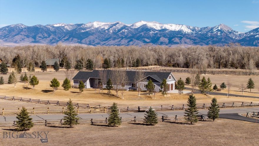 Welcome to 285 Waterfowl Way, a stunning custom-built home offered to the market for the very first time. This exceptional property sits on 10 breathtaking acres and captures incredible panoramic mountain views.

Montana rustic charm meets classic tradition in this thoughtfully designed home, which showcases beautiful neutral finishes and timeless craftsmanship. The main living area is an entertainer’s dream, centered around a spacious kitchen with a large island, abundant cabinetry, and generous prep space. Soaring windows frame the surrounding mountain vistas, filling the home with natural light, while a cozy gas fireplace anchors the living room and creates a warm gathering space. Beautiful wood floors serve as a classic tribute to Montana living.

Designed with single-level living and accessibility in mind, the home offers wide halls and doorways. The spacious and private primary suite includes a luxurious bathroom, complete with a relaxing soaker tub, large tiled walk in shower, heated tile flooring and abundant closet. Three additional guest bedrooms and two more bathrooms on the main level provide plenty of space for family and visitors.

An additional highlight of the home is the versatile bonus space, complete with its own guest bathroom and convenient kitchenette. This flexible area offers endless possibilities—perfect for a home gym, media room, hobby studio, or comfortable space for multigenerational living or extended guests. Thoughtfully designed to function independently from the main living areas, it provides both privacy and convenience while adding exceptional functionality to the home.

The oversized three-car garage offers ample room for vehicles, recreational gear, and all of your Montana toys. Outside, the property is beautifully landscaped with berms, raised garden beds and plenty of open space to enjoy the peaceful surroundings.

Horse lovers will appreciate that Cameron Bridge Estates allows up to two horses per property. Outdoor enthusiasts will love the access to the nearby Gallatin River, renowned for its blue-ribbon fishing, as well as state land located directly across the street.

This rare offering blends privacy, acreage, breathtaking views, and thoughtful design—creating the perfect Montana retreat just a short drive from Bozeman, Big Sky and the airport.