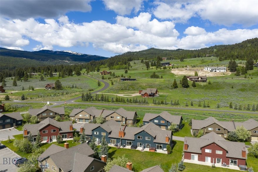 This beautifully maintained 1,850 sq. ft. two-story chalet offers the perfect mountain retreat, combining comfort, convenience, and proximity to all that Big Sky has to offer.

Featuring 3 spacious bedrooms—each with its own full bathroom and ample closet space—this home comfortably accommodates up to 8 guests. The layout is ideal for families, with a primary suite, a guest bedroom, and a well-appointed bunk room that sleeps four.

An open-concept living area with soaring cathedral ceilings and a stone fireplace invites cozy gatherings, while radiant heating in every room ensures year-round comfort. The fully equipped kitchen includes stainless steel appliances, abundant cookware, and seating for up to 10 across the dining table and breakfast bar.

Additional amenities include a one-car garage with ski storage, a separate laundry room, generous entry foyer with gear hooks, and a private hot tub that seats seven.

Located just one mile from Big Sky’s Town Center, the chalet offers easy access to shops, restaurants, markets, and seasonal events such as summer concerts and winter ice skating. Ousel Falls Trail is only a short walk away, and Big Sky Resort’s world-class skiing is just 7 miles from the property, accessible via car or free Skyline shuttle.

Summer activities include mountain biking, hiking, golf, horseback riding, fly fishing, and river rafting. Yellowstone National Park’s West Entrance is less than an hour’s scenic drive away.

Whether for a winter ski trip or a summer adventure, this turnkey chalet is the perfect basecamp for enjoying Big Sky year-round.