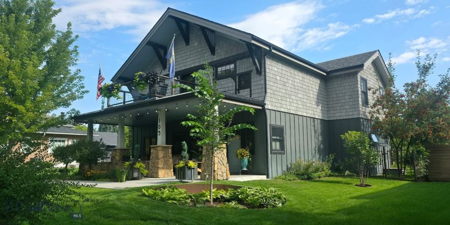 Livingston Luxury located on the coveted westside. This 3-story masterpiece was completed in June of 2015 and has served as a residence as well as Livingston’s only bed and breakfast for the past 11 years, A Stone’s Throw Bed and Breakfast.
Centered on a generous 60 x 140 foot lot with a profusion of trees, shrubs, vines, and flowering plants. Custom steel edging along all flower beds and hedging makes lawn care easy and tidy. The exterior of the main floor features board and batten, Hardie Board siding. The upper floor is sided with recycled PVC shingles. Stunning rock work along the front of the porch and chimney give this home presence of place. Spend your summer evenings on the porch talking with neighbors, entertaining family and watching the sunset. The upstairs balcony is the perfect outdoor spot for enjoying your morning coffee. Entering the front door, you are greeted with a show-stopping staircase and 2-story foyer. The stair treads and risers are repurposed, the sturdy, steel railing was welded in place. The foyer flows beautifully into the living room where the stone fireplace has a commanding focal point. The dining room, custom professional kitchen/walk in pantry, powder room, office/den, primary bedroom/bath,and walk-in closet, round out the main floor. Ceilings throughout the house are 9-feet or more; all studs are 2 x 6 giving heft to end walls and cased openings. Quality shines through with triple pane windows and bamboo floors.
The front staircase leads to the upper living room/balcony and three ensuite bedrooms/baths with dual shower heads and vaulted ceilings. There’s also an extra-large laundry room on the upper floor. At the end of the wide upstairs hallway, you can descend the back staircase to the mudroom of your dreams with doors leading to the garage, both side yards and kitchen.
The basement consists of a theater room, 2 more bedrooms with a Jack-and-Jill full bath. There’s also a large office, utility room and a space for storing your skiing, hiking and camping equipment.
The entire house is heated silently, all winter long with 5-zone radiant floor heat that even extends to the 2-car, attached garage. In the summer, there are mini-splits throughout the house to keep you cool on the hottest summer day. Solar panels on the south side of the roof keep your electric bill under $10 all year long. Put away your graph paper and colored pencils… close your drafting app… your dream home already exists! No showings  Feb 19-22 Call