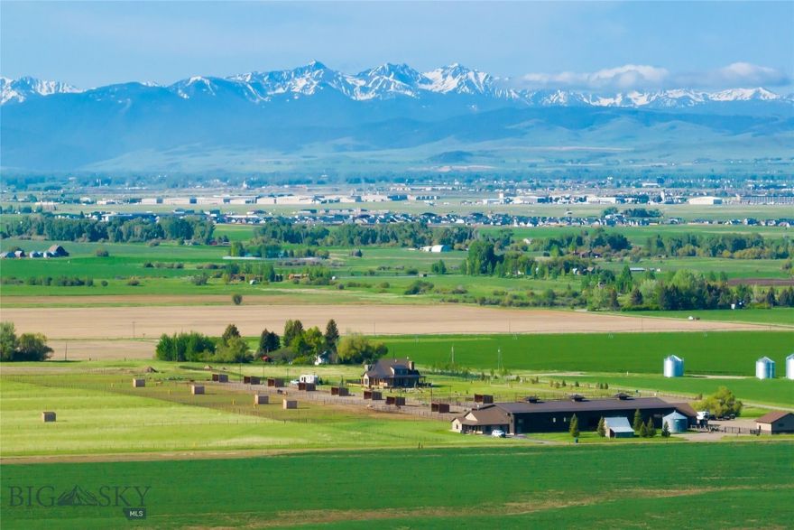Bandolero Ranch is a truly exceptional equestrian paradise outside the charming town of Bozeman, Montana. Nestled amidst the scenic beauty of the Montana countryside and the Bridger Mountains, this spectacular home offers unparalleled amenities and thoughtfulness of design, all to cater to the needs of horses and horse enthusiasts. As you approach the entrance and the gate swings open, you will be greeted by a property seamlessly
integrating horses and home. The main residence is quintessential Montana living, effortlessly combining form and function. The front door welcomes you with an artistic ironwork design, and there are beautiful hand-crafted floors and millwork throughout the architecturally designed home. There is a stacked stone fireplace, and the beautiful finishes feel luxurious, making for a lovely retreat at the end of the day. The wrap-around porch, beautiful garden spaces, and the meditation walk encourage outdoor dining, relaxation, or enjoying sunsets with a glass of wine while watching your horses a short distance away. As an avid horse enthusiast, the seller has spared no expense while developing this property. Approximately 49 acres of beautiful land are entirely perimeter fenced with steel pipe fencing. The property has been thoughtfully designed with multiple corrals, paddocks, and horse shelters, each with an automatic waterer. There is an oversized hay barn and a separate tractor barn for storing all your equipment. The spectacular indoor riding arena allows a horse enthusiast to train, jump, or ride year-round, and the mirrors imported from Germany provide a flawless reflection allowing you to perfect your riding technique. The generously sized caretaker's home at the east end of the riding arena invites morning coffee on the porch while the sun rises over the mountains. Located in Belgrade, this extraordinary equestrian property provides a serene
and private retreat, yet it is conveniently located just minutes away from the vibrant city of Bozeman, renowned for its world-class amenities, dining, and cultural attractions. Don't miss the opportunity to own this magnificent high-end horse property in Montana. Immerse yourself in luxury, indulge in natural beauty, and create lasting memories in this extraordinary equestrian sanctuary. Schedule your private tour today and experience the ultimate blend of refined living and equestrian excellence.