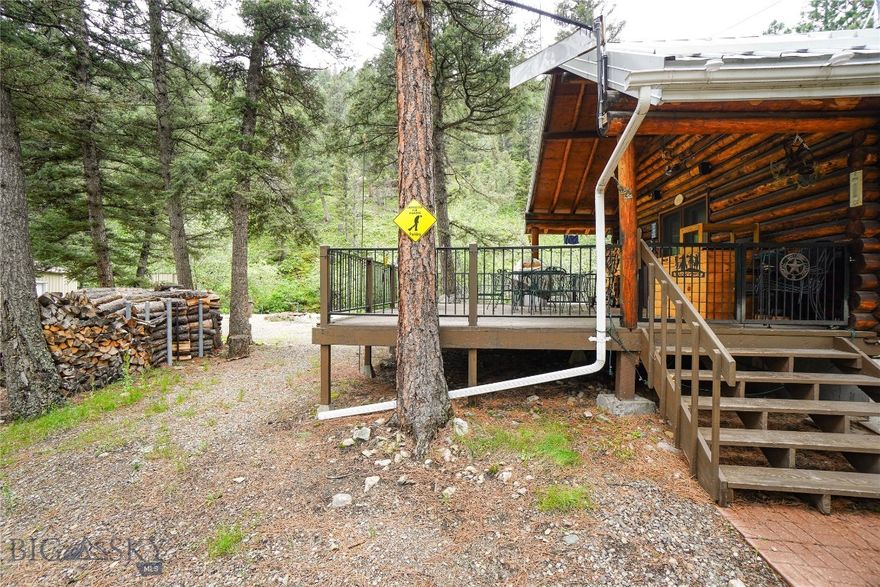 This amazing all season cabin property truly has it all. With Little Wolf Creek gurgling past your kitchen window, the serenity of mountain life will take your breath away. The cabin itself boasts 2 bedrooms downstairs as well as a loft bedroom upstairs. It has all the modern conveniences of home, to include a bathroom, internet, and modern appliances. The oversized woodstove and additional propane heater will keep you toasty warm when the snow is flying. Outside you will be pleased to know that there is not one, but two shops for extra storage for all the toys you might have to explore the area. The 32x28 foot shop is insulated, has a wood stove and houses the backup generator, inverter, and batteries. The 30x24 foot metal Quonset is finished with a concrete floor an adds some amazing space for your boat, or UTVs.  

Located about 15 minutes outside the quaint fishing town of Wolf Creek, the great outdoors is the star of the show in this area. If you enjoy 20+ inch trout straightening out your hooks, or lake fishing on some of the best Walleye waters Montana has to offer then this might be the place for you. There are vast public lands to explore nearby as well for hiking, hunting, or whatever your heart desires. Helena, the state capital, is less than an hour from the property and has all conveniences of a larger metropolitan city. With inventory in the area at all-time lows, and the features this property boasts, please don’t delay. All sizes, distances, years, and square footages are approximate, and to be verified by buyer. Cabin Bullets: - 1344 Sq Foot Cabin (960 main level) - 3 bedrooms/1 bath - Advanced solar/panels/battery system (new batts in 2019) - Backup generator - Star link internet equipment conveys with sale - Well and septic - Foundation installed – 2011 - Roof and crawl space insulated/foamed – 2013 - New windows throughout - 2013 - Year-round creek (Little Wolf Creek) - 32x28 foot insulated shop - 30x24 foot Quonset building - 43 Miles to Helena Airport and Costco - 16.5 Miles to Holter Lake - 14 Miles to upper Missouri river boat access (Wolf Creek) - General hunt district for deer/elk