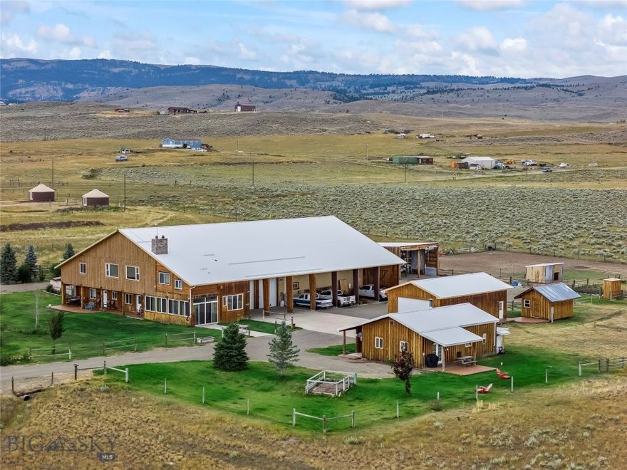 Live the Montana dream on 20 sprawling acres in Sheild’s Valley, with loads of income producing potential and panoramic views of the Bridger and Crazy Mountains. This unique property features 3 custom built homes, a studio apartment, and 2 yurts, perfect for guests, tenants, or your own vision of life under the “Big Sky”. The main house custom features include real wood flooring, slate tile details, radiant flooring in bathrooms, a fireplace, 2 wood stoves and more- Truly a must see! Modern comfort with Montana charm. Property includes a 75x112 attached heated barn/garage/shop with horse stalls, plus another 25x40 heated shop and additional outbuildings. Located conveniently between Bozeman and Livingston, and just minutes to Bridger Bowl skiing. This property offers a rare turnkey opportunity with endless possibilities, rental income, multi-generational living, hobby farm or your own Montana escape.