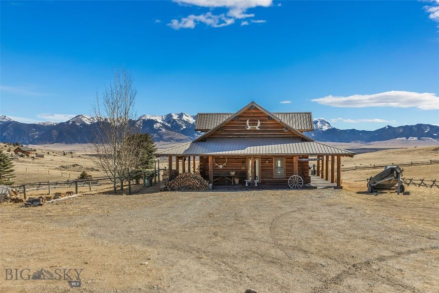 Set just outside of Ennis yet still within the Ennis community, this beautiful 2216± square foot (per owner) custom log home offers privacy, views, and Montana character on 5.197± acres of partially fenced open ground. With three levels of living space, the home is designed to capture both comfort and functionality while taking full advantage of its scenic setting. The main level features the kitchen, dining, and living areas anchored by warm log construction, pine hardwood floors, and a wood stove that adds both charm and comfort. The kitchen is currently being updated, offering the opportunity for refreshed finishes while maintaining the home's inviting layout. The lower level includes the primary bedroom, bathroom, mechanical room, and laundry. A sliding glass door opens to a deck facing east toward the Madison Range, a perfect spot to take in morning light and mountain views. The upper loft provides flexible space for guest accommodation, an office, or hobbies. Outdoor living is a highlight with a wraparound covered porch that invites you to relax and enjoy the surrounding landscape and wildlife. The property includes two 30x60 new pole barns, offering a blank slate for storage, shop space, livestock, or recreational equipment. A small dry cabin and additional shed add further versatility for guest overflow, a studio, or extra storage. Located close to the Madison River and abundant public lands, this property provides convenient access to fishing, hiking, hunting, and endless outdoor recreation. This subdivision boasts private stocked lakes. The home is served by a well and septic, with fiber internet available to the house but not yet connected. Kitchen does not have all the cabinets & can be finished your way.