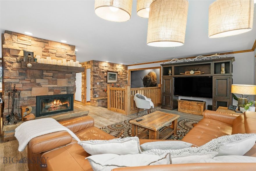 Discover this amazing opportunity to live in a beautiful sanctuary on almost half an acre of land. Situated in a peaceful .44-acre location that gives you a countryside feel, yet is just minutes away from downtown Bozeman. Relax on the back deck or enjoy the hot tub on the patio while listening to the calming sounds of Bozeman Creek. Keep an eye out for the various wildlife that may visit you in this tranquil retreat. The 3122 square foot home features five bedrooms, 2.5 bathrooms, and is being sold fully furnished. The main level offers an open layout with stunning barnwood tile flooring, a spacious living room, and dining area flooded with natural light from large windows. The kitchen includes a Miele gas range/oven and a large wood chop block island perfect for hosting guests. Descend a few steps to find a guest bedroom with a family room featuring extra tall ceilings and windows. A few more steps down lead to a luxurious master suite, another guest bedroom, a full bathroom, and a den/office. The walkout basement provides two additional bedrooms, a laundry and storage area, and a wine closet. Also included is a 2-car garage for your convenience. Don't forget to consider purchasing the adjacent .585-acre parcels (see MLS 399174  and 400325 for more information).