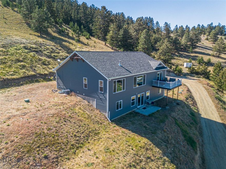 Perched where the earth meets the sky, this 2018-built, single-owner sanctuary offers 2,884 square feet of modern elegance on a spacious 1.4-acre lot. The heart of the home is an expansive open-concept living area, designed to draw your eyes toward the Belt Mountains through floor-to-ceiling vistas. Retreat to the main-floor primary suite, where you can wake up to spectacular sunrises before stepping into your spa-inspired ensuite.

The lower level is a world of its own, featuring a walk-out patio and three generous bedrooms—perfect for guests or a growing family. Yes, the driveway is a bit of a climb—but it’s the literal stairway to the best views in the area. Best of all? We’re bringing back "pre-2020" value to one of the most sought-after neighborhoods around. Don’t miss the chance to own the horizon.