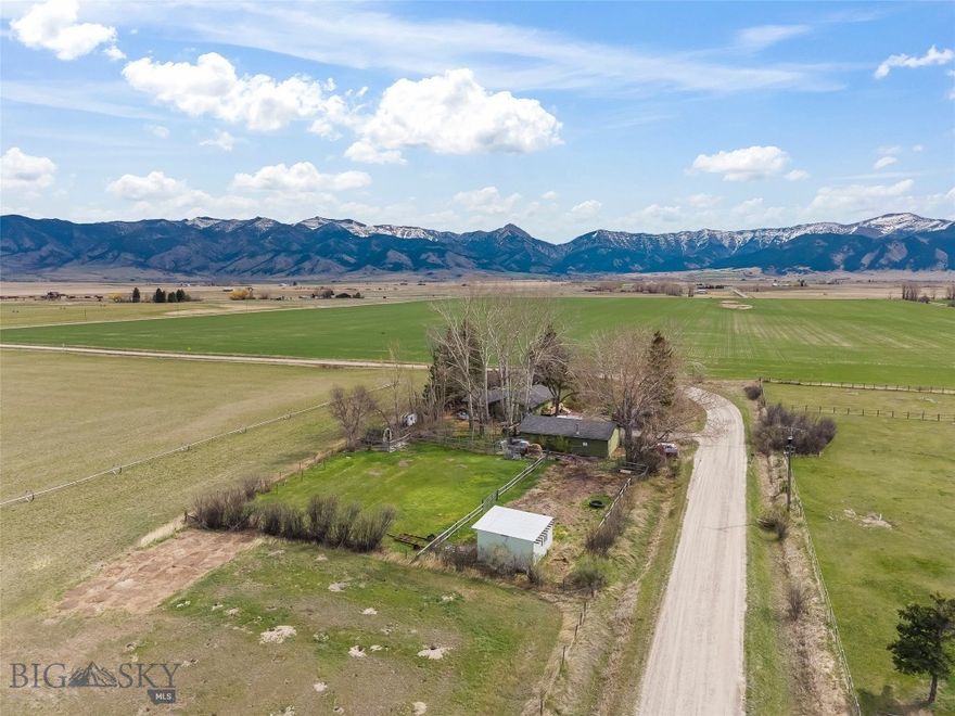 Dreaming of a country home just minutes from both Belgrade and Bozeman? This unique 2-acre property North of town off of Springhill Road offers space, flexibility, and Montana lifestyle at its finest. Featuring a 2,320± sq. ft. home, this property includes two separate 1-acre parcels, providing incredible opportunity for future expansion, investment, multi-generational living or a remodeling project.

Enjoy a peaceful setting surrounded by farmland and mature trees, and just down the road from the East Gallatin River, known for some of the area’s best fly fishing. Whether you're looking to create your own private sanctuary or build a second home on the additional lot, the possibilities here are truly endless.

The property is ideal for those seeking a hobby farm or self-sufficient lifestyle, with room for chickens, goats, and expansive garden space. While open skies and quiet surroundings offer a relaxed, rural feel.

The existing home features 3 bedrooms, 2 bath along with a 2-car garage and additional shop space (being used for horse barn) perfect for storage, projects, or equipment.

No covenants, strong rental potential, and long-term value make this a rare and versatile offering. More space, more freedom, more opportunity to create the lifestyle you’ve been looking for.