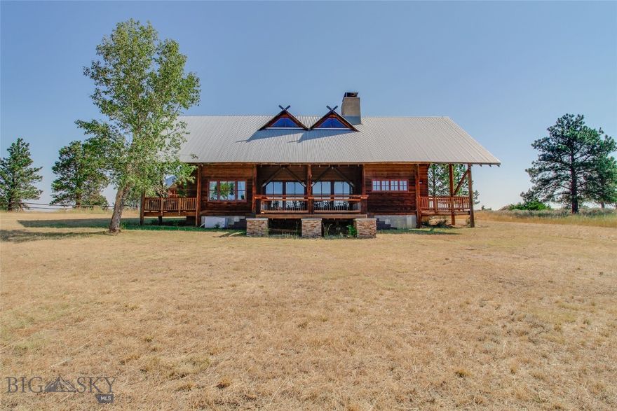 This architectural award-winning home sits on a nearly 20-acre homestead with exceptional views of the Beartooth and Crazy Mountain ranges, fenced corrals, a large shop with an apartment-style in-law suite with a recently updated bathroom, a barn with horse stalls, and a vineyard. This rustic three-bedroom, two-story home has geothermal heating and newly refinished floors. The kitchen has wooden cabinets, modern appliances, a farmhouse sink, and a tiled floor. The stately great room with a 30-ft vaulted ceiling is flooded with natural light by wall-to-wall windows, exposed beams, and a timeless wood-burning fireplace. A recently remodeled bathroom with a newly installed bathtub rounds out this home’s main-floor living space. This property offers unparalleled beauty and functionality. The large shop on the property offers ample room for hobbies and storage, with an additional full bathroom. Buyer/buyer’s agent to verify. Info deemed reliable but not guaranteed.