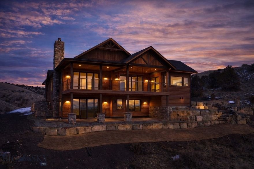 Riverfront luxury in Gallatin River Ranch. This newly constructed 4,500sq ft residence sits on 20+/- acres with approximately 660 feet of Gallatin River frontage. The setting offers some of the most incredible and expansive views in Gallatin County. Enjoy sitting on from the covered deck, overlooking the river and enjoying the scenery and wildlife, including a resident elk herd. Designed and built by Vidmar Construction, the 3 bedroom, 3.5 bath home features vaulted ceilings, luxury vinyl plank flooring, Thermador appliances, an oversized island, formal dining room, butler’s pantry, bonus room over the garage and a wine room. Both propane and wood-burning stone fireplaces add warmth and architectural interest. Large windows throughout the home are thoughtfully placed to capture river and mountain views from nearly every room. The oversized primary suite has two walk in closets, a large en suite bathroom, fireplace and it's own generously sized private patio looking out over the river. Outdoor features include over $200,000 in professional landscaping, a covered Trex-style deck, and a propane fire pit, ideal for enjoying the natural surroundings. Additional amenities include a heated garage, Kohler backup generator, 1,000-gallon underground propane tank, Starlink internet, Unifi security cameras and Wi-Fi access points, water softener and reverse osmosis system. Ability to build a second home on the property with plans available for a larger residence. This is a rare opportunity to own a newly built riverfront property in one of Montana’s most sought after communities.