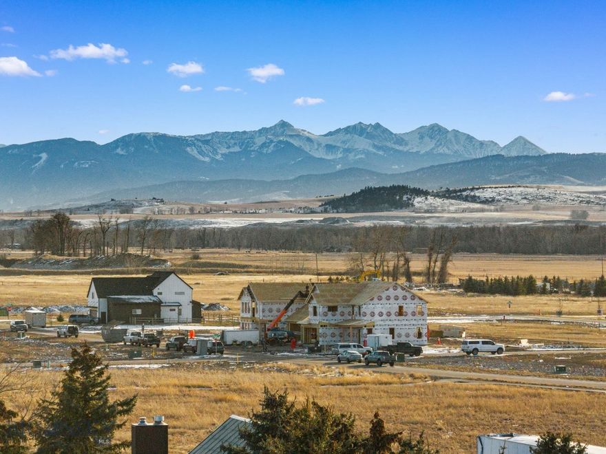 Discover the ideal setting for your future home on Bozeman’s highly sought-after west side, where wide-open skies and breathtaking mountain views define everyday living. Spanning just under half an acre, this exceptional parcel offers a rare combination of space, scenery, and location. The lot captures sweeping panoramic vistas of the Gallatin, Madison, and Bridger Mountain Ranges, creating a stunning backdrop that shifts beautifully with every season. Perfectly positioned to balance convenience with Montana lifestyle, the property offers quick access to Big Sky and the Gallatin Canyon, placing world-class skiing, fly fishing, hiking, and mountain biking all within easy reach. Downtown Bozeman is just a short drive away, offering acclaimed dining, boutique shopping, local events, and year-round community energy, while the west side continues to grow as one of the area’s most desirable locations thanks to its accessibility, newer amenities, and open surroundings. Whether you envision a custom residence or a thoughtfully designed spec build, this nearly half-acre lot provides the space, views, and flexibility to bring your vision to life. Opportunities to build in such a well-positioned area with expansive mountain scenery are increasingly rare, making this a truly special place to create your Montana home.