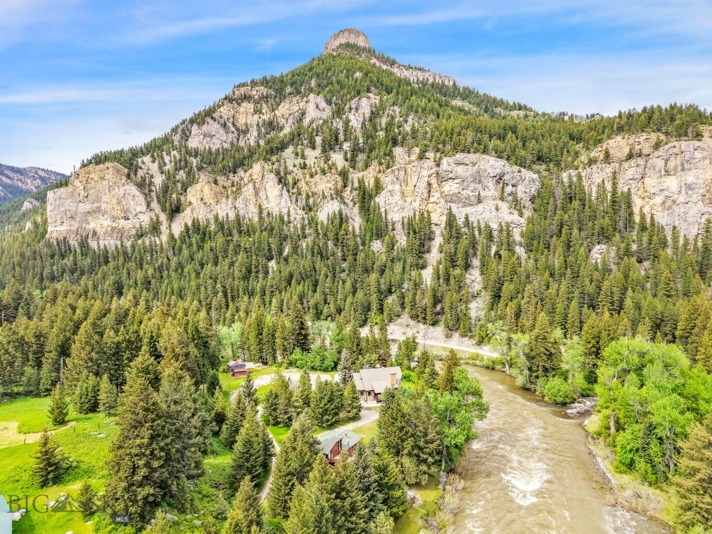 A River Runs Beside It and the Magic Flows With It. Tucked off Highway 191 and nestled along the banks of the Gallatin River, this cherished family cabin sits on two separate parcels totaling nearly half an acre (.49 acres+/-) of some of the most scenic land in Montana. It offers a setting so rare, it feels like something out of a film, because it is. A River Runs Through It was filmed just beyond the back door, a testament to the landscape’s timeless beauty. Whether you’re an avid angler or someone who finds peace in the sound of water rushing over rock, this place delivers. Fish legendary holes right from your backyard, with Storm Castle Creek joining the Gallatin just downstream. Prefer whitewater to waders? Raft or kayak right to your own stretch of riverbank, then warm up in the sauna or plunge back in for round two. The cabin itself is full of rustic charm and cozy character. A wood-burning fireplace anchors the living space, and a vintage wood stove adds warmth and ambiance to the kitchen. With two bedrooms and one and a half baths, the layout is relaxed with a hint of retro and ready for your vision or perfect just the way it is. If you’ve been searching for a true Montana riverfront escape, one with soul, story, and an unbeatable location...this is it! Come feel the magic for yourself.