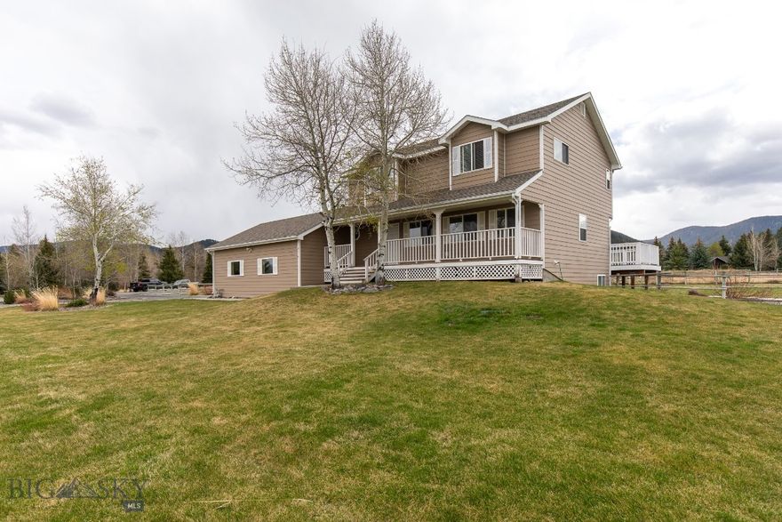 This inviting 4-bedroom, 3.5-bath home offers over 3,100 sq ft of comfortable, flexible living space on 1.3+ fully fenced acres. With a main-level living room and a spacious family room downstairs, there’s room for everyone to spread out and enjoy their own corner of the home.

The kitchen is impressively spacious, featuring abundant counter space and a large pantry that keeps everything organized and within easy reach. It’s a layout designed for cooking, hosting, and everyday living.

Step outside to enjoy multiple decks, perfectly positioned to take in the gorgeous views. There’s even dedicated space wired and ready for a spa, giving you the opportunity to create your own private retreat.

Gardeners will appreciate the irrigated raspberry bushes, grape vines, and apple trees, offering a mini orchard right in your backyard. For projects, storage, or hobbies, you’ll love the 2-car attached garage paired with a detached shop, providing excellent space for tools, toys, and year-round projects.

This property blends space, privacy, and functionality in a way that’s hard to find, giving you room to live, grow, and enjoy Montana living at its best.