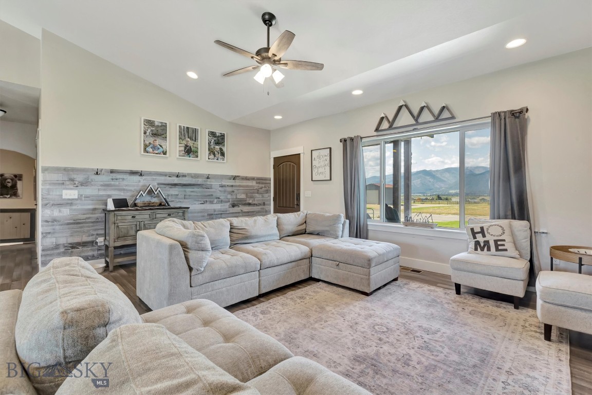 This is a must-see 5-bedroom, 3-bathroom home nestled on 2.54 acres in the stunning Bitterroot Valley. The main floor offers 1,768 square feet of open-concept living with vaulted ceilings and breathtaking views. The kitchen features elegant dark cabinetry, stainless steel appliances, and a spacious island. The main level also includes a luxurious master suite, a convenient laundry room, and two additional bedrooms with a shared bathroom.
The finished 1,689 square foot basement includes a cozy living room area, two more bedrooms, and a full bathroom. The backyard is complete with a storage shed, concrete patio, charming gazebo, and a relaxing hot tub. This spacious property offers a unique opportunity for customization with the ability to build your own shop just steps away from your home! Don't miss out on the opportunity to enjoy these spectacular mountain views!
