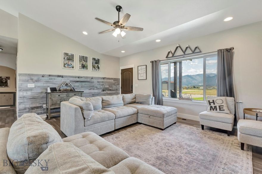 This is a must-see 5-bedroom, 3-bathroom home nestled on 2.54 acres in the stunning Bitterroot Valley. The main floor offers 1,768 square feet of open-concept living with vaulted ceilings and breathtaking views. The kitchen features elegant dark cabinetry, stainless steel appliances, and a spacious island. The main level also includes a luxurious master suite, a convenient laundry room, and two additional bedrooms with a shared bathroom.
The finished 1,689 square foot basement includes a cozy living room area, two more bedrooms, and a full bathroom. The backyard is complete with a storage shed, concrete patio, charming gazebo, and a relaxing hot tub. This spacious property offers a unique opportunity for customization with the ability to build your own shop just steps away from your home! Don't miss out on the opportunity to enjoy these spectacular mountain views!