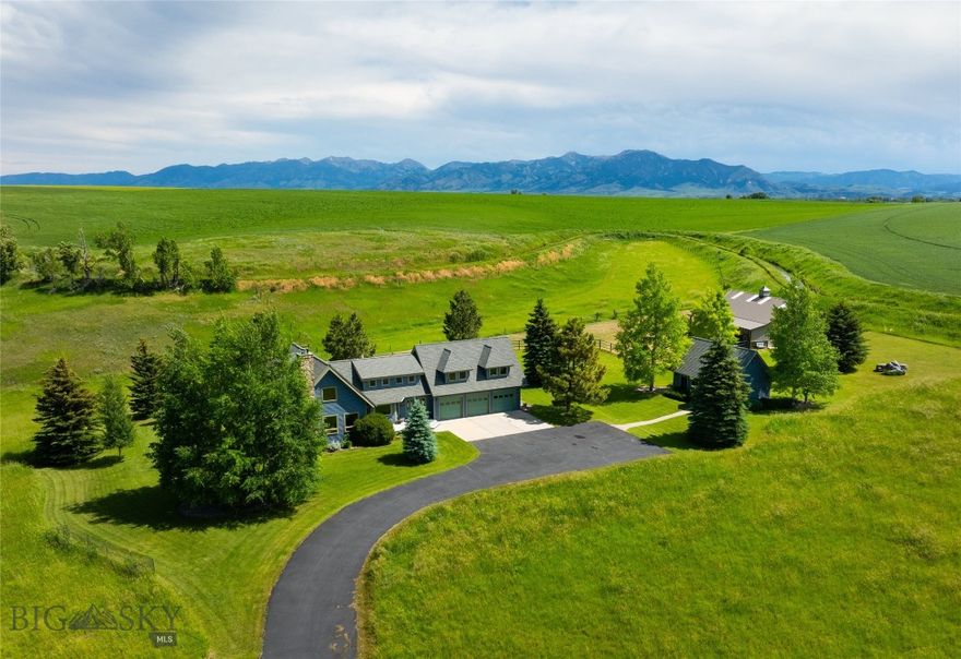Enjoy the quiet, western landscape of Big Sky country from this picturesque horse property set on 22+ acres. Surrounded by farmland in conservation and larger parcels this 4B|3B custom home with barn and ADU/Studio will WOW even the most discerning buyers. You’ll come to treasure the "forever" views of the Spanish Peaks, valley at large, and gently waving grasslands. The east and north side of the property are bordered by trails and farmers canal with stunning views of the Bridger Mountains and private walking path, excellent for your daily exercise routine and enjoyment of live water. You’ll also enjoy end-of-road privacy and the peace that it affords. Crafty home layout maximizes square footage while showcasing amenities that make ranch life easy, such as the large, light-filled laundry and separate mudroom, two staircases to access the second level from either end of the house, and a work-horse kitchen with double ovens, granite counters, gorgeous cherry wood cabinetry, large center island, and built-in breakfast nook, that can feed a couple or a crowd. This quintessential country estate is ideal for the equestrian; 22 acres, 3 fenced pastures and a 3-stall barn will ensure happy horses have room to roam. The barn is outfitted with an office/tack area, drive-thru concrete flooring, and lofted storage for versatile uses. Additional studio/ADU on the property makes for an ideal work-from-home setup with large picture windows and bathroom. House guests will sign up months in advance to stay with you! Spectacular country location where big city life is left behind to revel in the charm of the western town of Gallatin Gateway; house to the legendary Stacey’s Steakhouse/Bar, ElGallo Cantina, and Post Office Pizza.  5 minutes to Gallatin River fishing access, 15 minutes to bustling Downtown Bozeman for shopping and fine dining, and a short 30 mile drive to Big Sky for world class skiing. Come take advantage of all the natural wonders that make this area of Montana one of the most sought after places in the United States of America. Make your appt today to see this high-quality built home and property!
