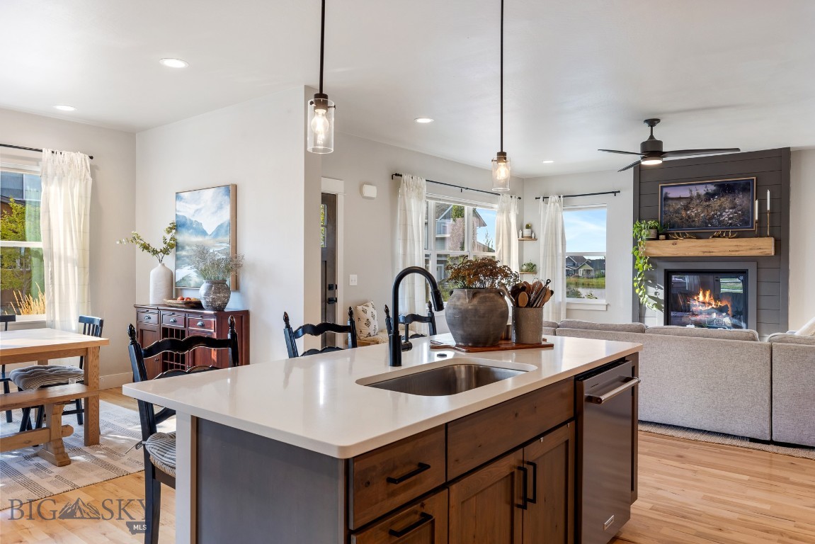 Welcome to The Lakes at Valley West, one of Bozeman’s most sought-after neighborhoods. Where mountain views, walkable waterfronts, and thoughtfully designed homes create an exceptional living experience.
Nestled on a quiet street near park space with views of the lake from inside the home, this meticulously crafted 2021 built, 4-bedroom, 2.5-bath home blends luxury and comfort with high-end finishes throughout. Designed with intention and built to the highest standards, it offers a lifestyle as impressive as its surroundings.
Step inside to discover soaring 9-foot ceilings, solid maple hardwood floors, and an abundance of natural light streaming through oversized windows that frame every room. The open-concept living area is ideal for entertaining or everyday living, featuring a cozy gas fireplace and generous dining space. The chef-inspired kitchen with knotty alder cabinetry, a gas cooktop, and high-end finishes offer refined style and effortless functionality.
The main-level primary suite is a private retreat, boasting a spa-like bathroom with a dual-head tile shower, and a spacious custom walk-in closet. Upstairs, a flexible bonus room offers endless possibilities - whether you need a home office, media space, or playroom. The covered balcony lets you enjoy Montana’s four seasons with your morning coffee or evening glass of wine.
Beyond your doorstep, The Lakes community invites you to live outdoors: paddleboard or fish on two private lakes stocked twice yearly with trout and perch, skate in the winter when neighbors gather to clear sections of the frozen lake, or explore miles of scenic trails and pedestrian-friendly woonerfs that foster a true neighborhood feel.
With proximity to top-rated schools, shopping, restaurants, and recreation, and easy access to all that Bozeman has to offer, this home delivers not just a place to live, but a lifestyle to fall in love with. Beautifully crafted home by well known and highly respected builder; Zach Wermers/Black Mountain Construction. Call your favoirite agent today to schedule a showing.