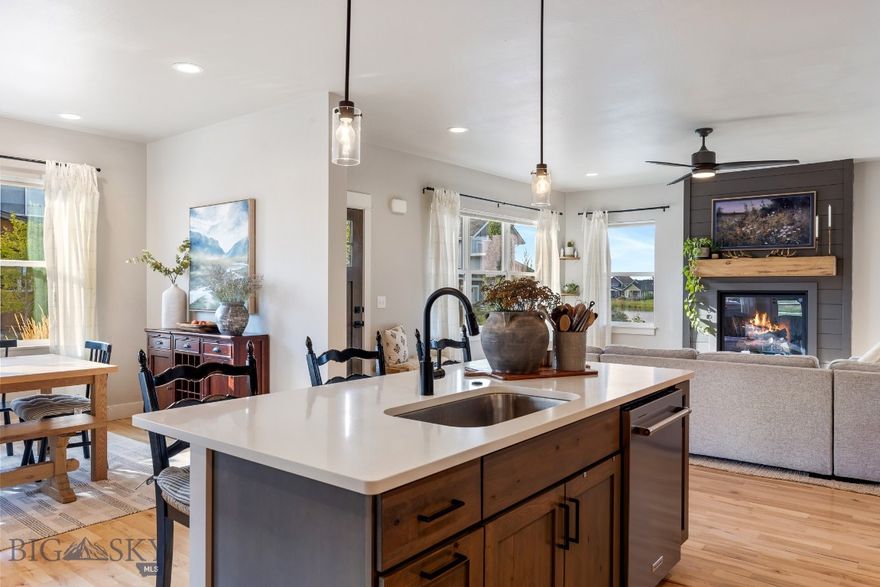 Welcome to The Lakes at Valley West, one of Bozeman’s most sought-after neighborhoods. Where mountain views, walkable waterfronts, and thoughtfully designed homes create an exceptional living experience.

Nestled on a quiet street near park space with views of the lake from inside the home, this meticulously crafted 2021 built, 4-bedroom, 2.5-bath home blends luxury and comfort with high-end finishes throughout. Designed with intention and built to the highest standards, it offers a lifestyle as impressive as its surroundings.

Step inside to discover soaring 9-foot ceilings, solid maple hardwood floors, and an abundance of natural light streaming through oversized windows that frame every room. The open-concept living area is ideal for entertaining or everyday living, featuring a cozy gas fireplace and generous dining space.  The chef-inspired kitchen with knotty alder cabinetry, a gas cooktop, and high-end finishes offer refined style and effortless functionality.

The main-level primary suite is a private retreat, boasting a spa-like bathroom with a dual-head tile shower, and a spacious custom walk-in closet. Upstairs, a flexible bonus room offers endless possibilities - whether you need a home office, media space, or playroom.  The covered balcony lets you enjoy Montana’s four seasons with your morning coffee or evening glass of wine.

Beyond your doorstep, The Lakes community invites you to live outdoors: paddleboard or fish on two private lakes stocked twice yearly with trout and perch, skate in the winter when neighbors gather to clear sections of the frozen lake, or explore miles of scenic trails and pedestrian-friendly woonerfs that foster a true neighborhood feel.

With proximity to top-rated schools, shopping, restaurants, and recreation, and easy access to all that Bozeman has to offer, this home delivers not just a place to live, but a lifestyle to fall in love with. Beautifully crafted home by well known and highly respected builder; Zach Wermers/Black Mountain Construction. Call your favoirite agent today to schedule a showing.